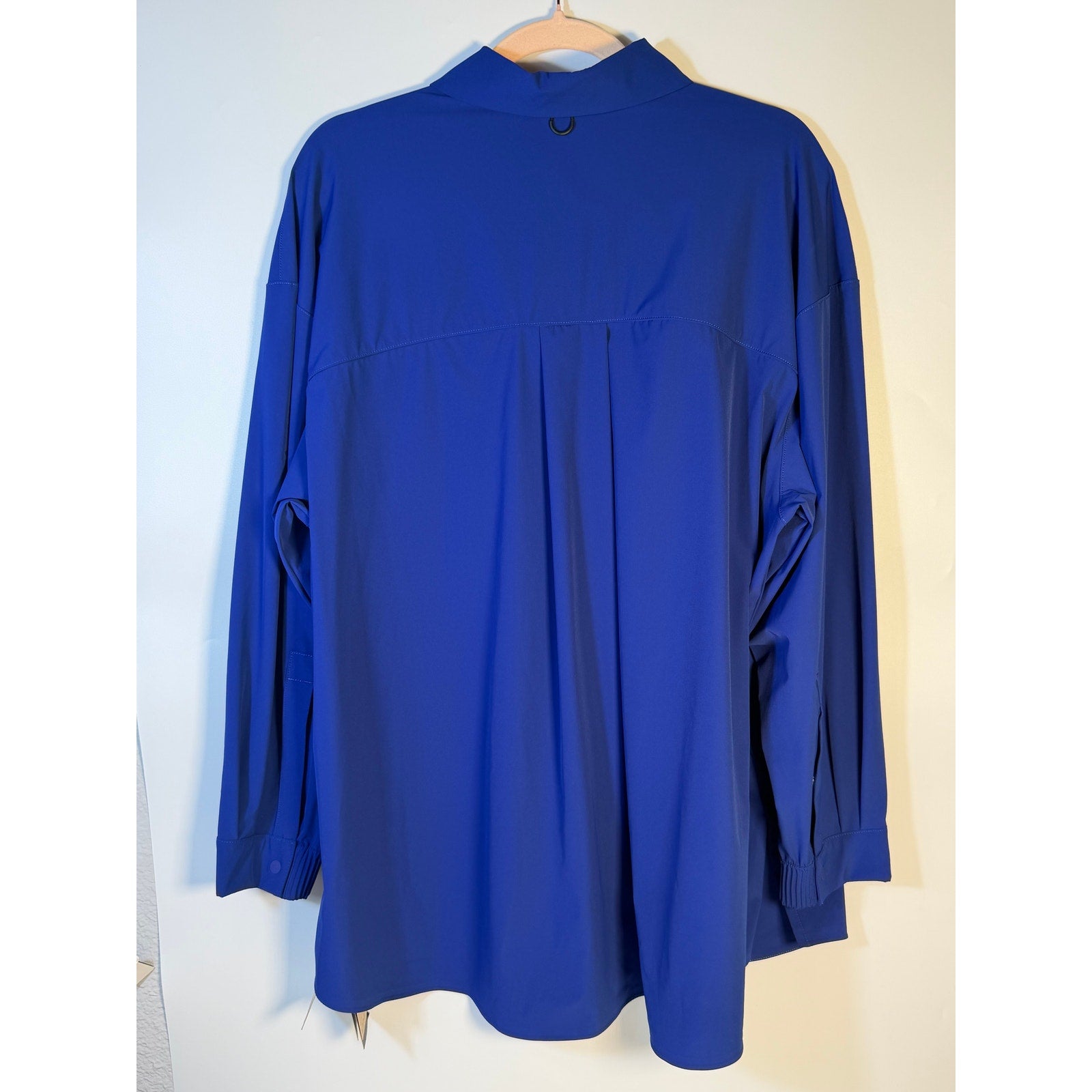 Nike 24.7 Women's Medium Blue Dri-FIT training button front shirt, lightweight athletic top with breathable fabric and front buttons.