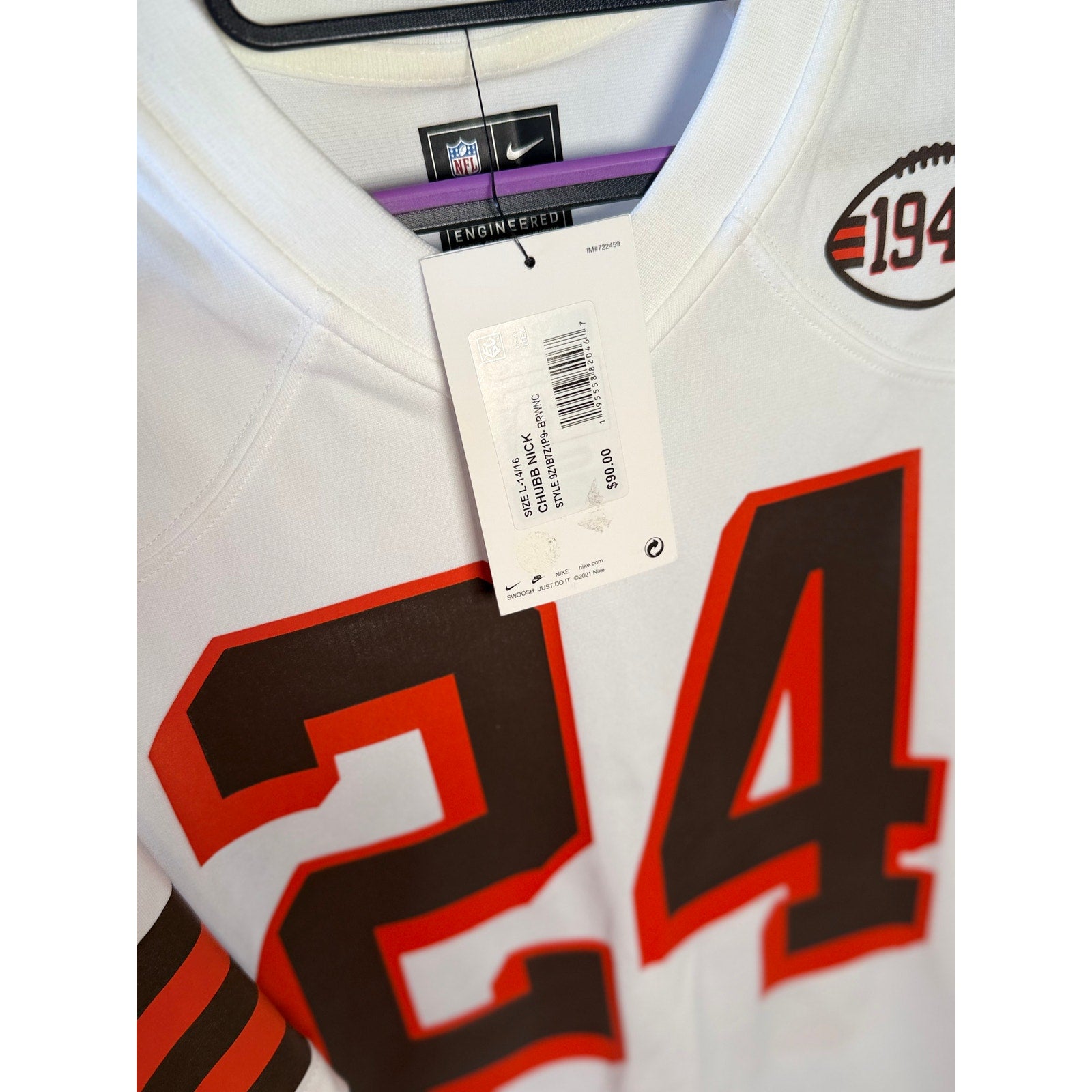 Nike Cleveland Browns youth #24 NFL white game jersey, size large (14-16), with team logo and player number visible.