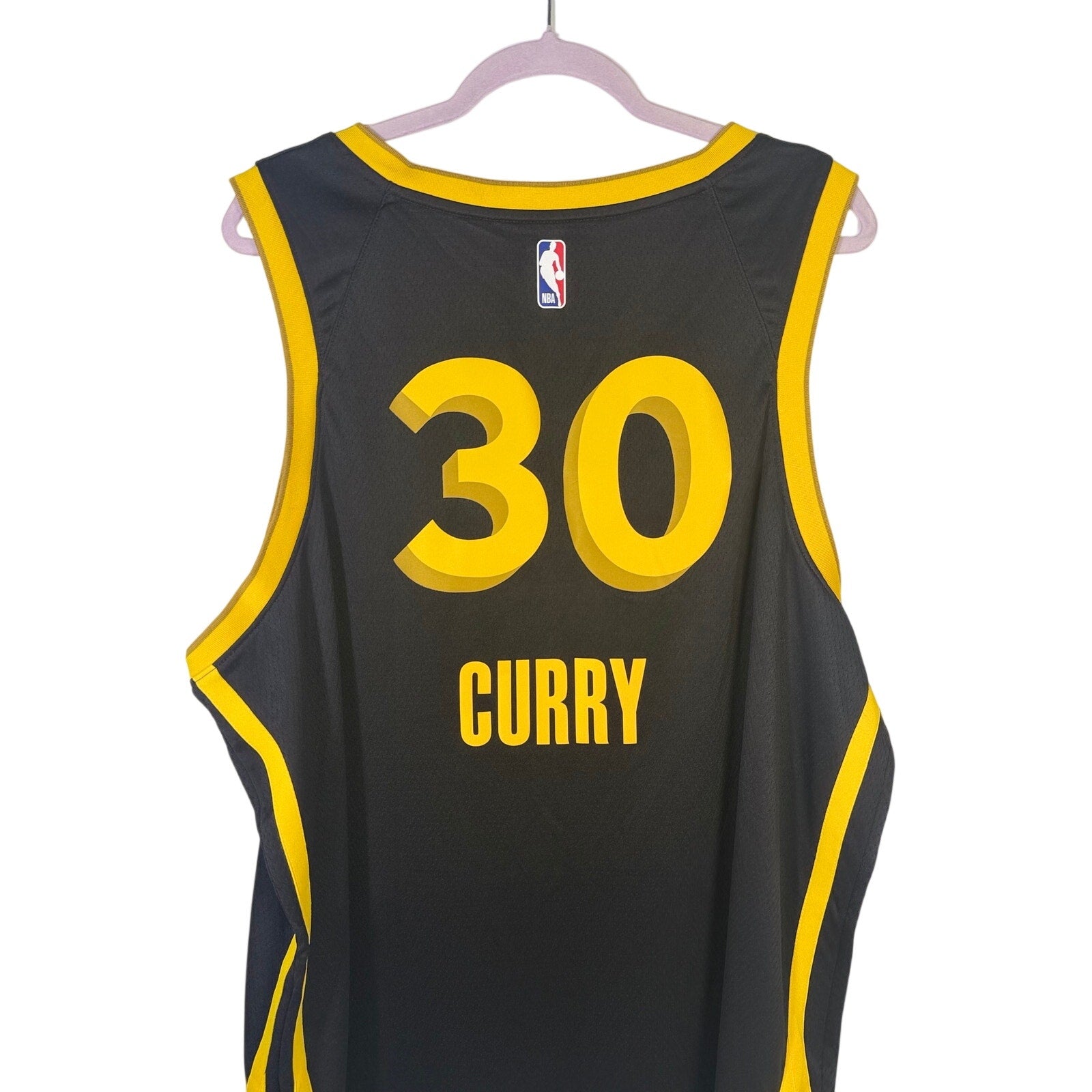 Men's Nike Stephen Curry Golden State Warriors Swingman jersey in black and yellow, size XXL, featuring team and player details.