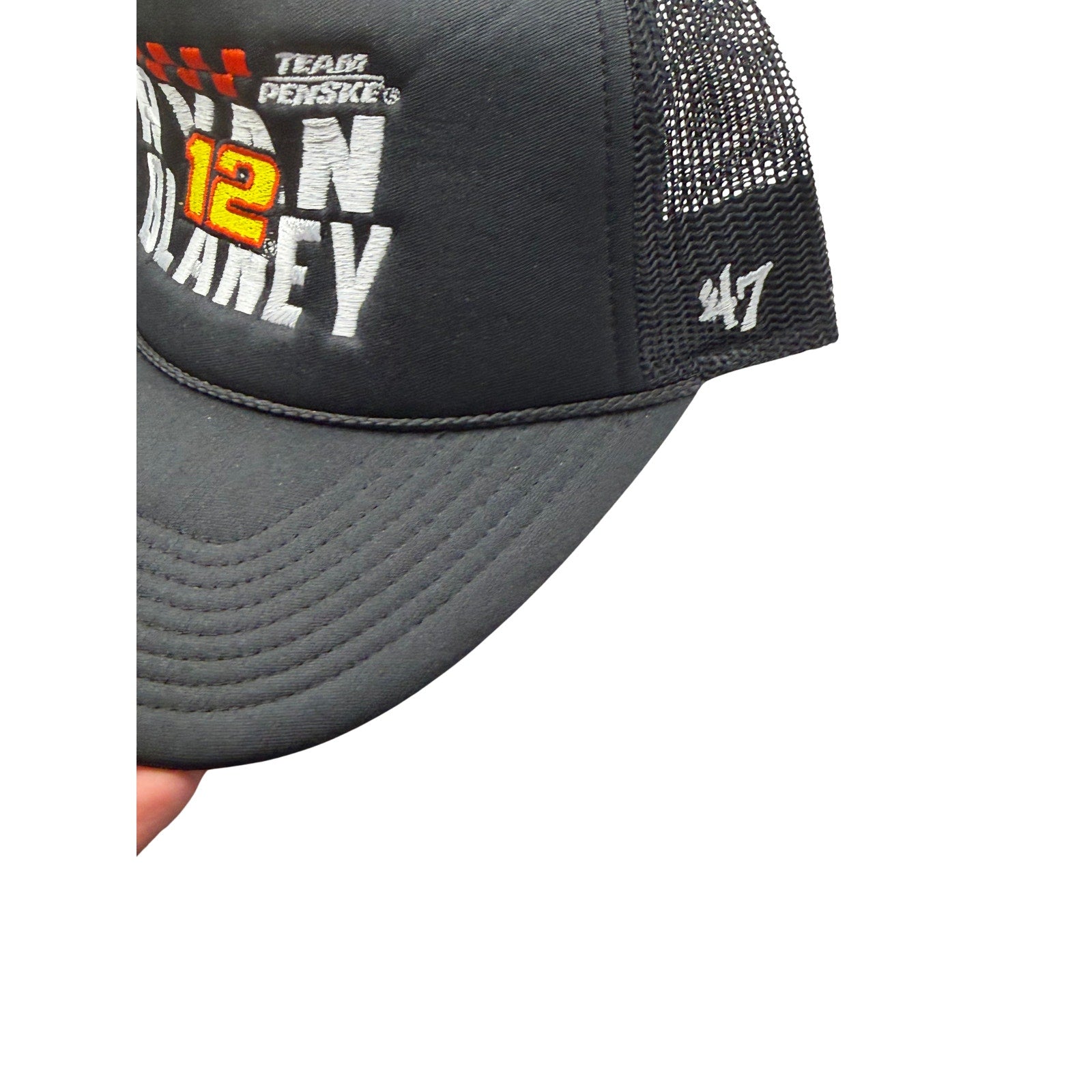 Black NASCAR Ryan Blaney #12 Team Penske ’47 Trucker Snapback Hat with front logo and mesh back panels.