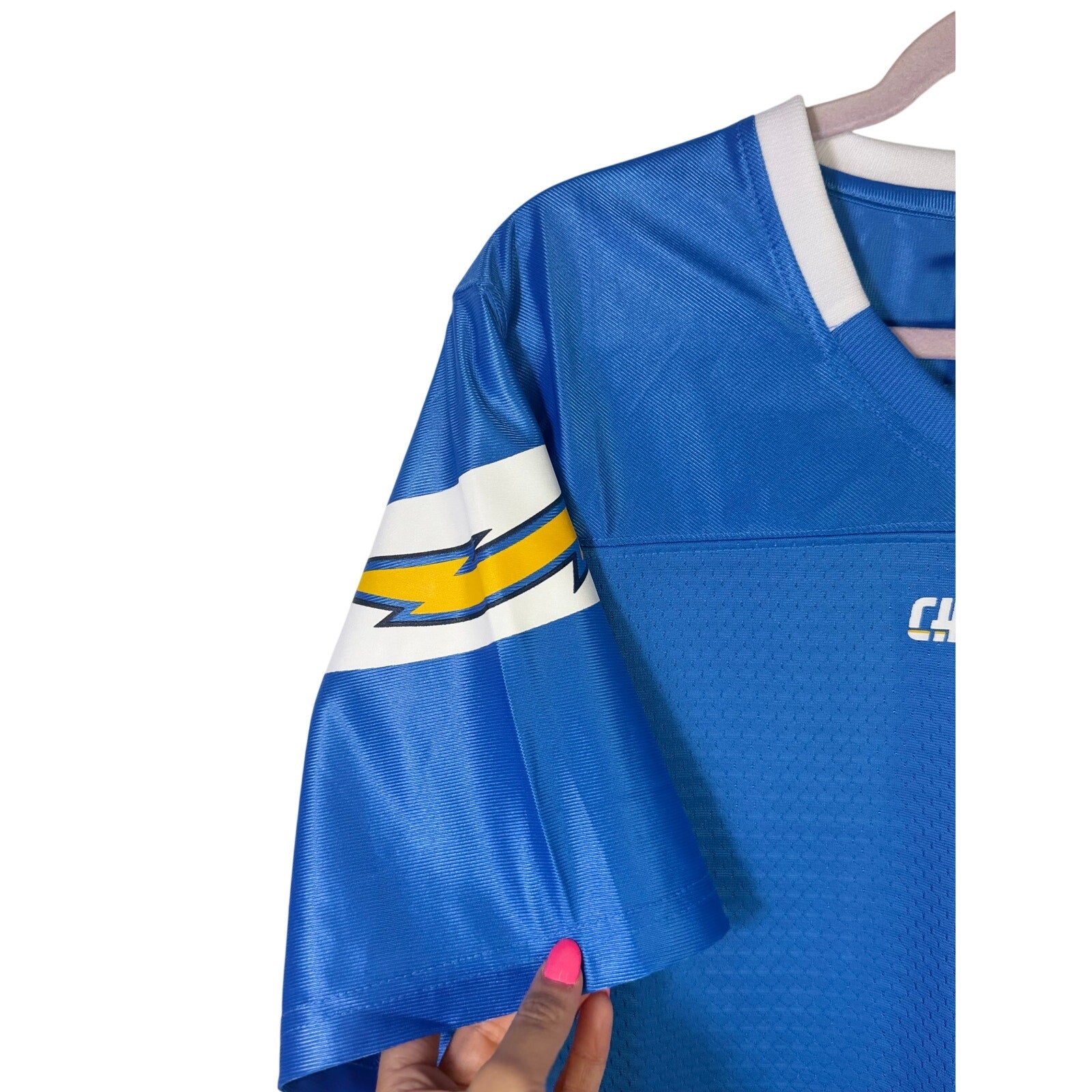 NFL Players Women’s Los Angeles Chargers blue football jersey, size L, new with tags, featuring team logo and player details.