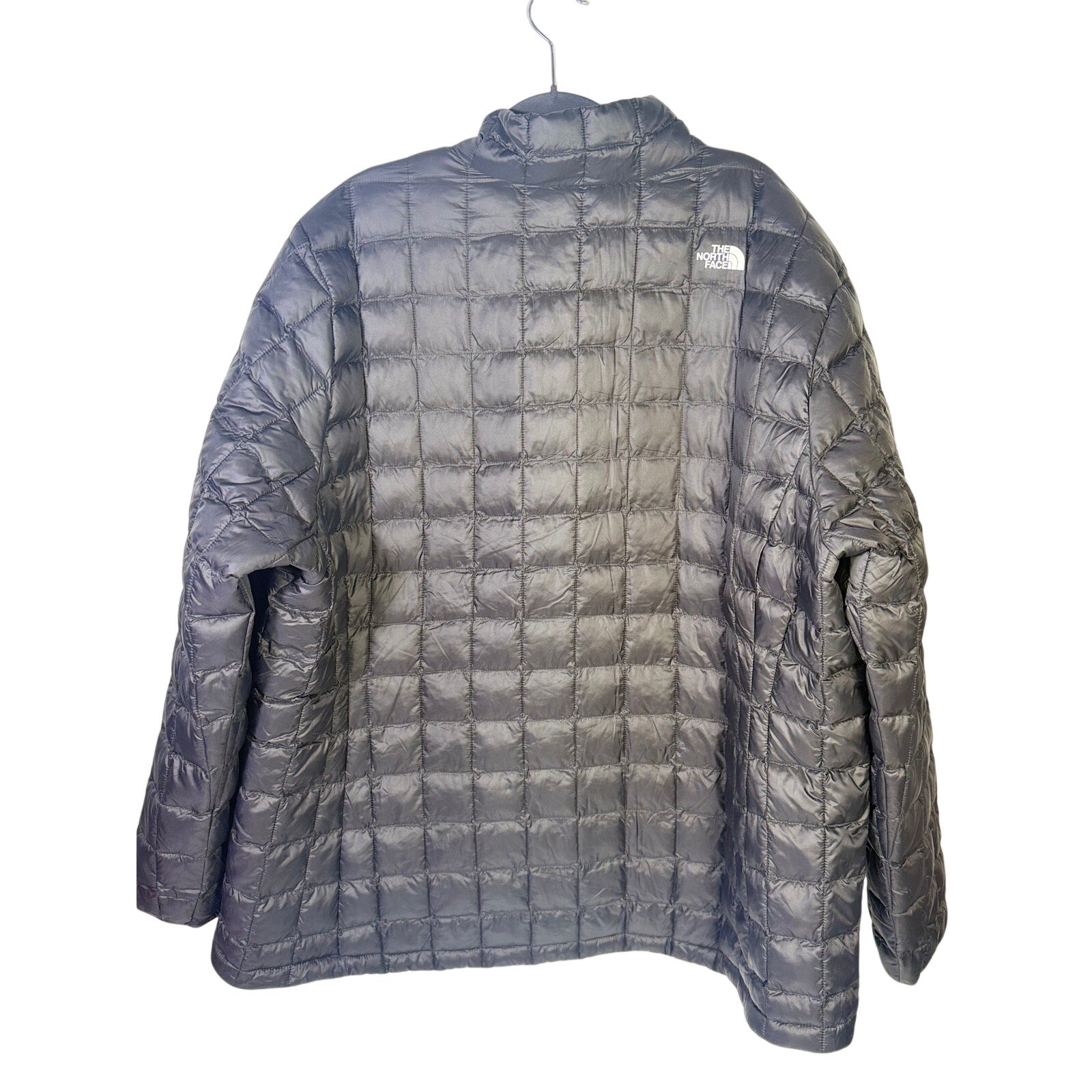 The North Face Women’s Plus ThermoBall Eco Jacket in black, size 3X tall, displayed with front zipper and insulated design.