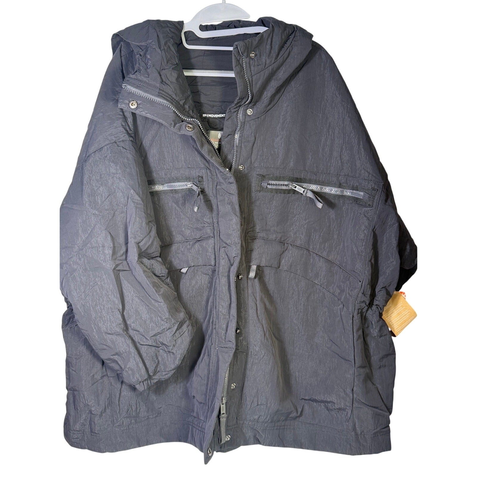 Black hooded utility jacket hoodie by Free People, women’s size M/L with front pockets and adjustable drawstrings.