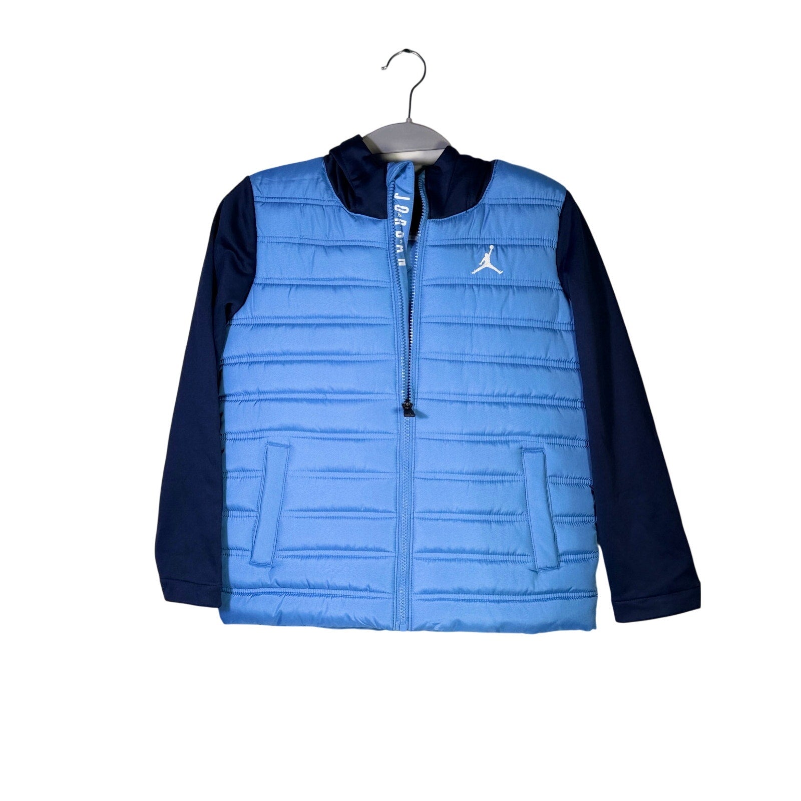 Jordan Boys Legend Blue Hybrid Puffer Jacket in size small, front view showing the blue quilted puffer design and logo details.