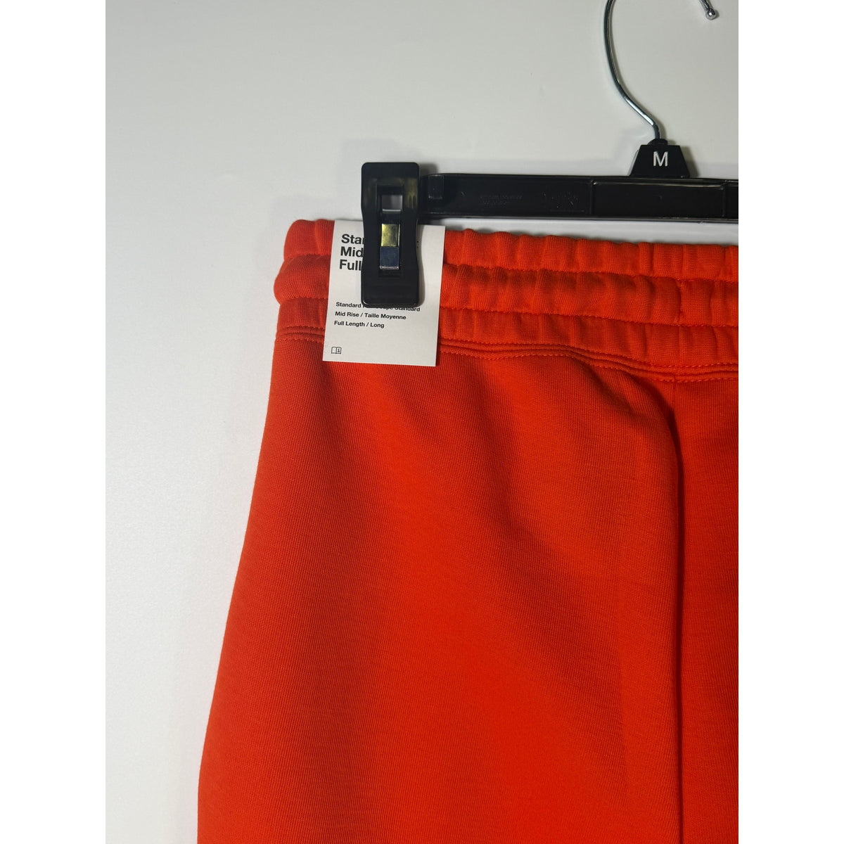 Nike Sportswear Phoenix Fleece Jogger Pants for women in bright orange, mid-rise design, XS size, soft fleece fabric.