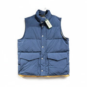 Alpine Design men's blue insulated puffer vest with snap front, lightweight and warm, suitable for outdoor cold weather.