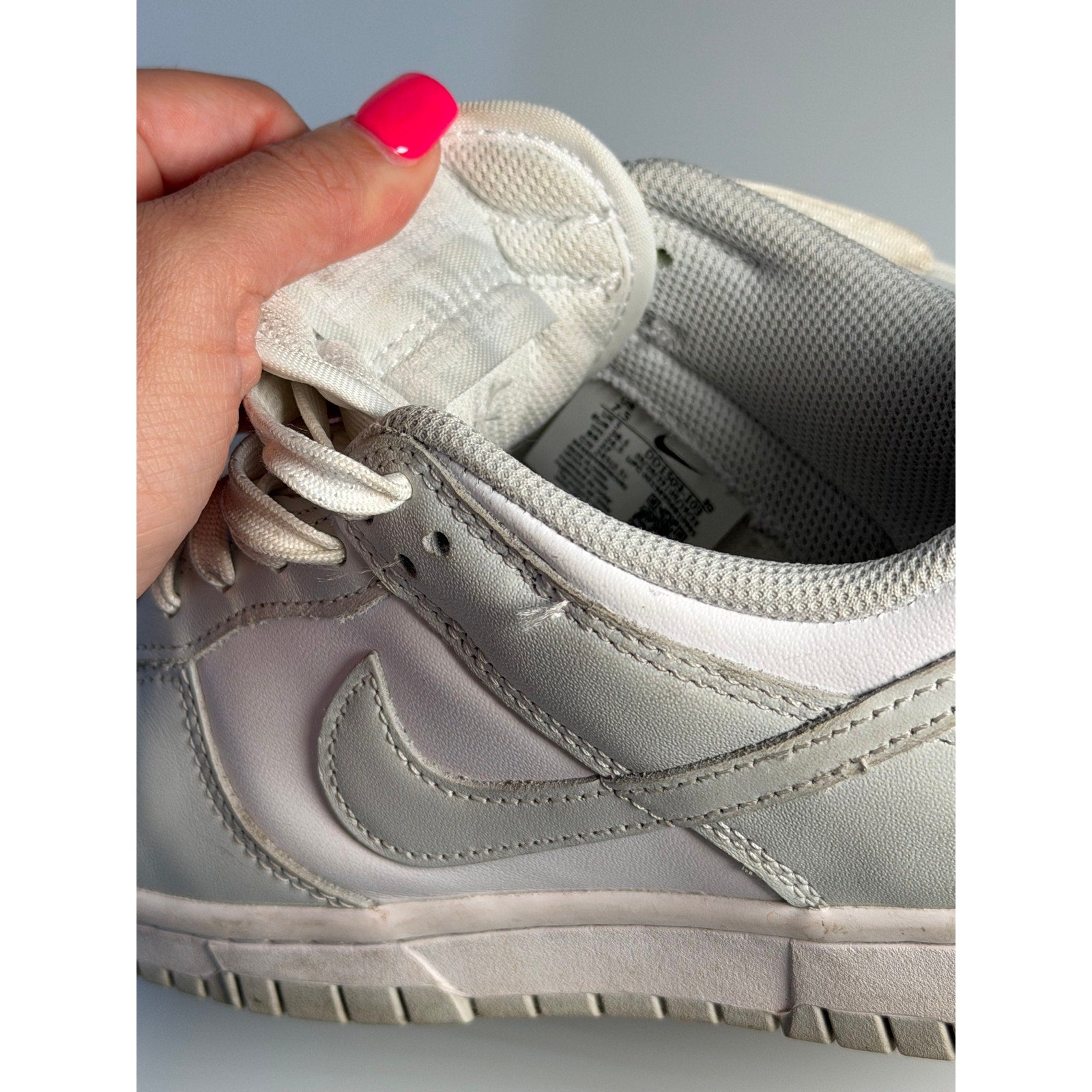 Nike Dunk Low Triple White sneakers for men, size 7.5, featuring white leather casual shoes with a classic low-top design.