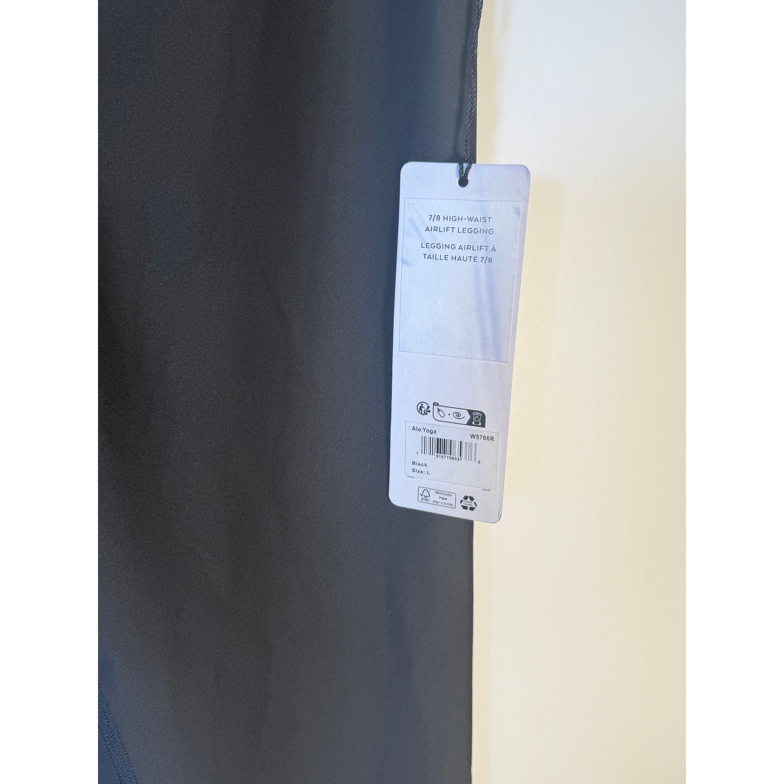 Black Alo Yoga Airlift 7/8 high waist leggings for women, large size, showcasing a snug fit and sleek design.
