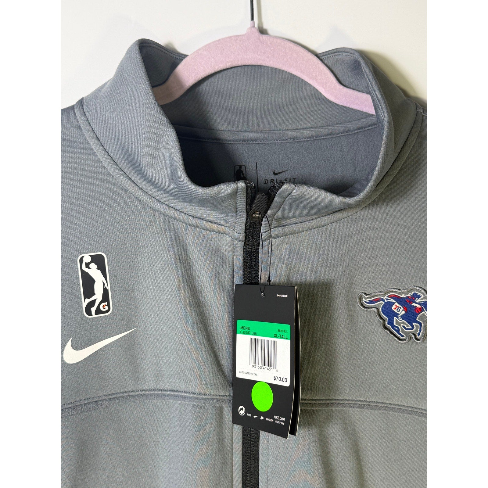 Nike G League Team Issued full zip performance jacket in gray, size XL Tall, with Nike branding and athletic design details.