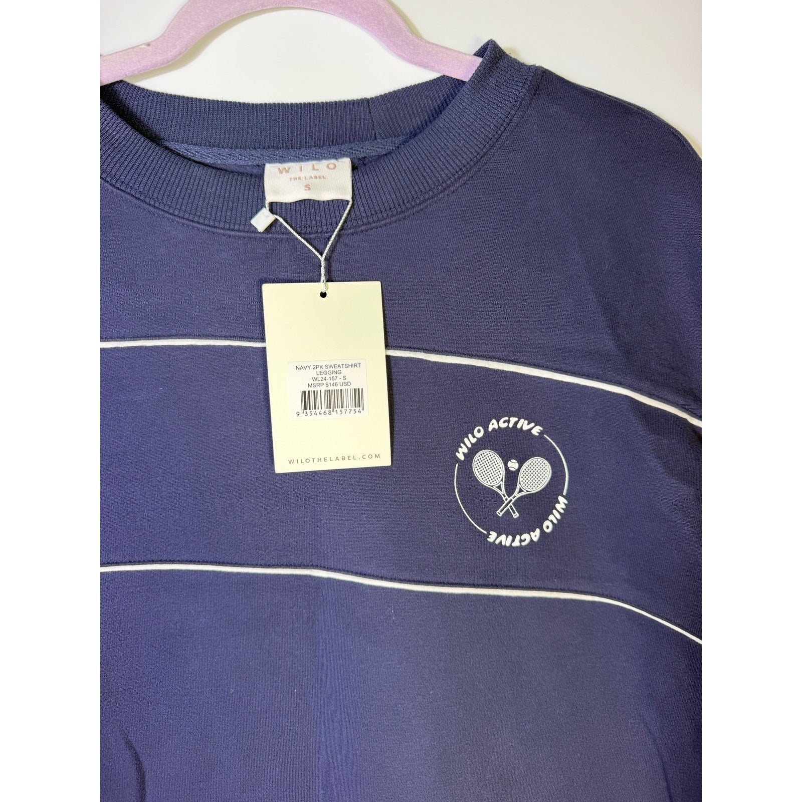 Wilo The Label women's navy 2-piece sweatshirt and leggings set, size S, featuring comfortable fabric and casual style.