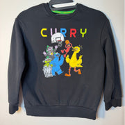 Youth Medium Under Armour Curry Sesame Street black crewneck sweatshirt with colorful Sesame Street characters on the front.