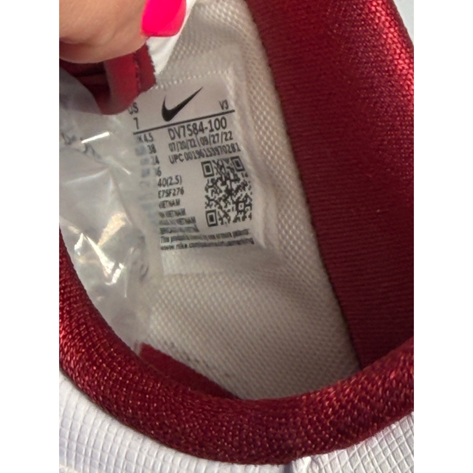 Nike Air Force 1 '07 LV8 men's white and red sneakers, size 7, with classic design and Nike branding.