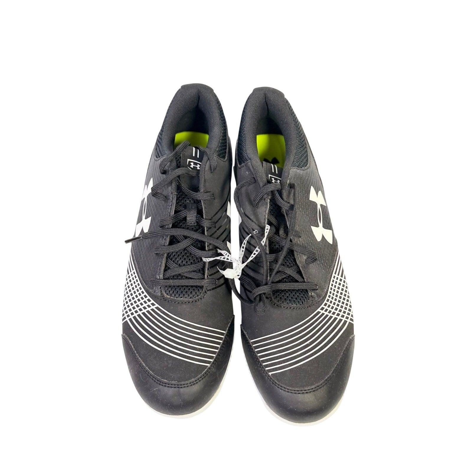 Under Armour men's baseball cleats in black and white, size 12, molded athletic shoes for baseball players.