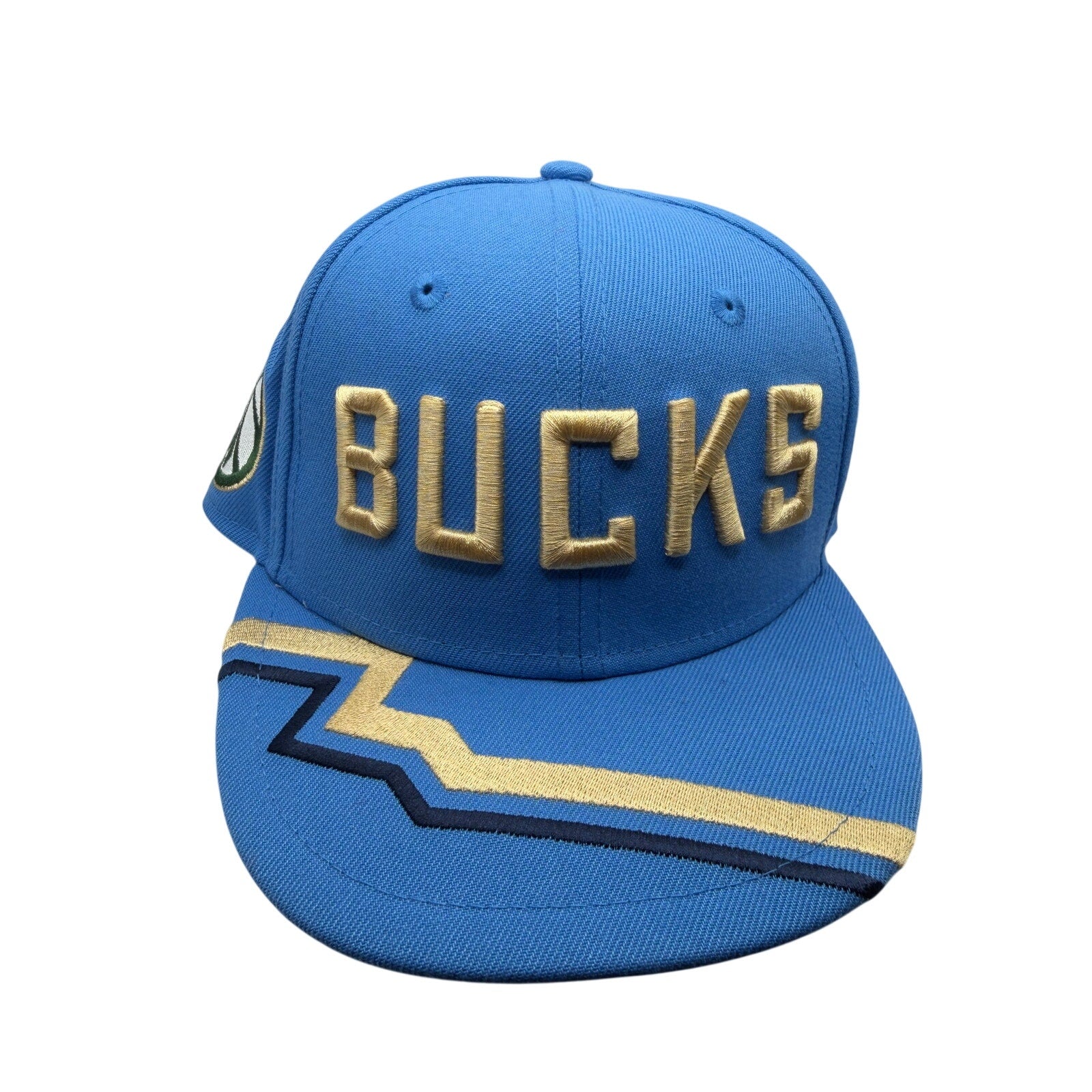 Blue Milwaukee Bucks NBA New Era 9FIFTY snapback hat with gold accents, front logo, and adjustable strap.