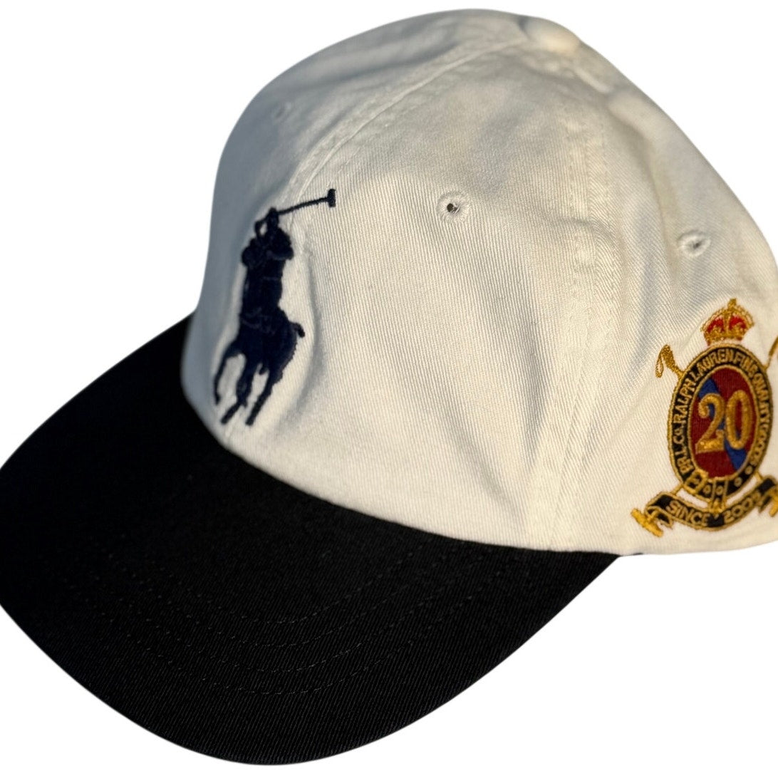 White Polo Ralph Lauren baseball cap with 20th Anniversary Big Pony logo, adjustable strap, and classic style.