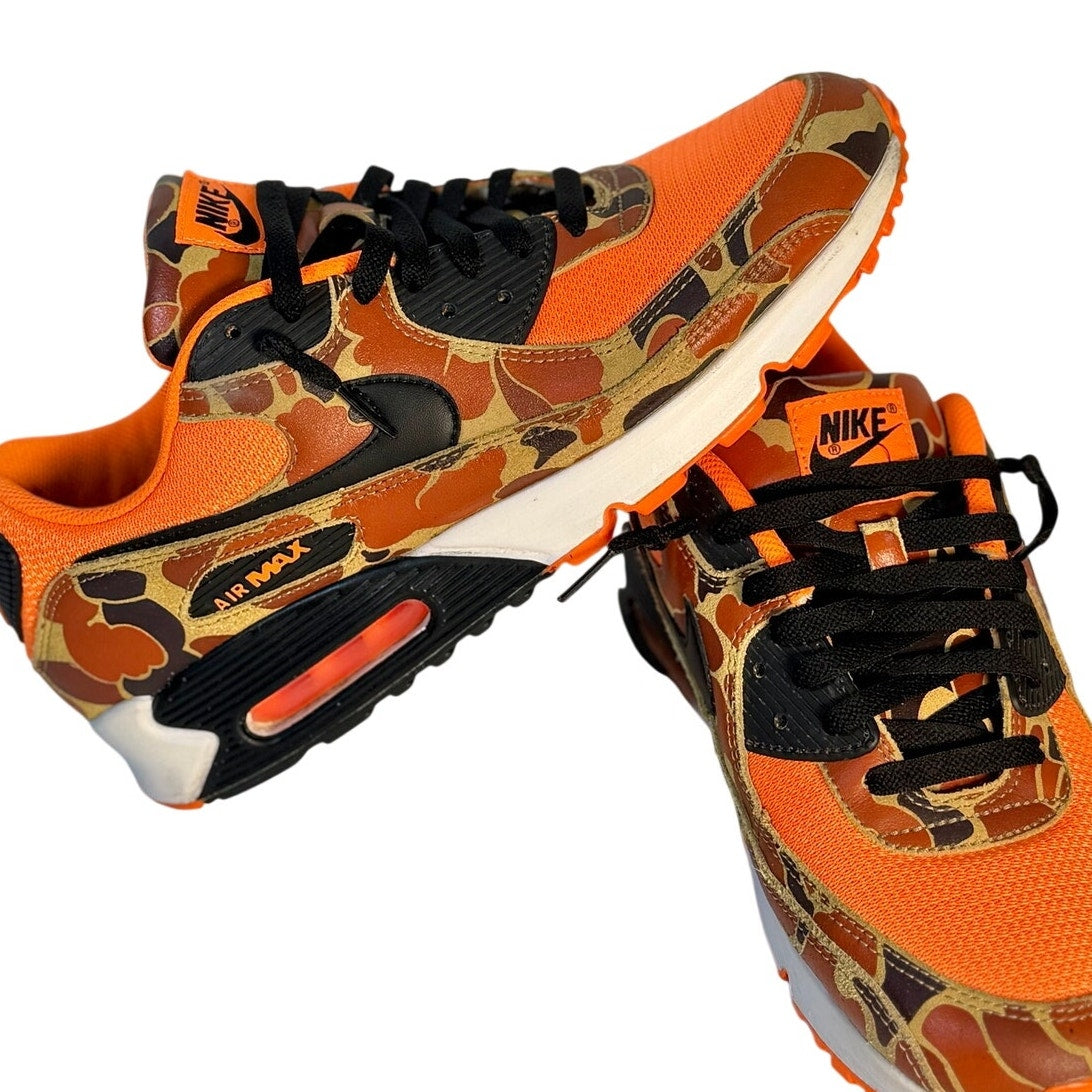 Nike Air Max 90 orange camo and black sneakers for men, size 11, featuring stylish design and cushioned sole.