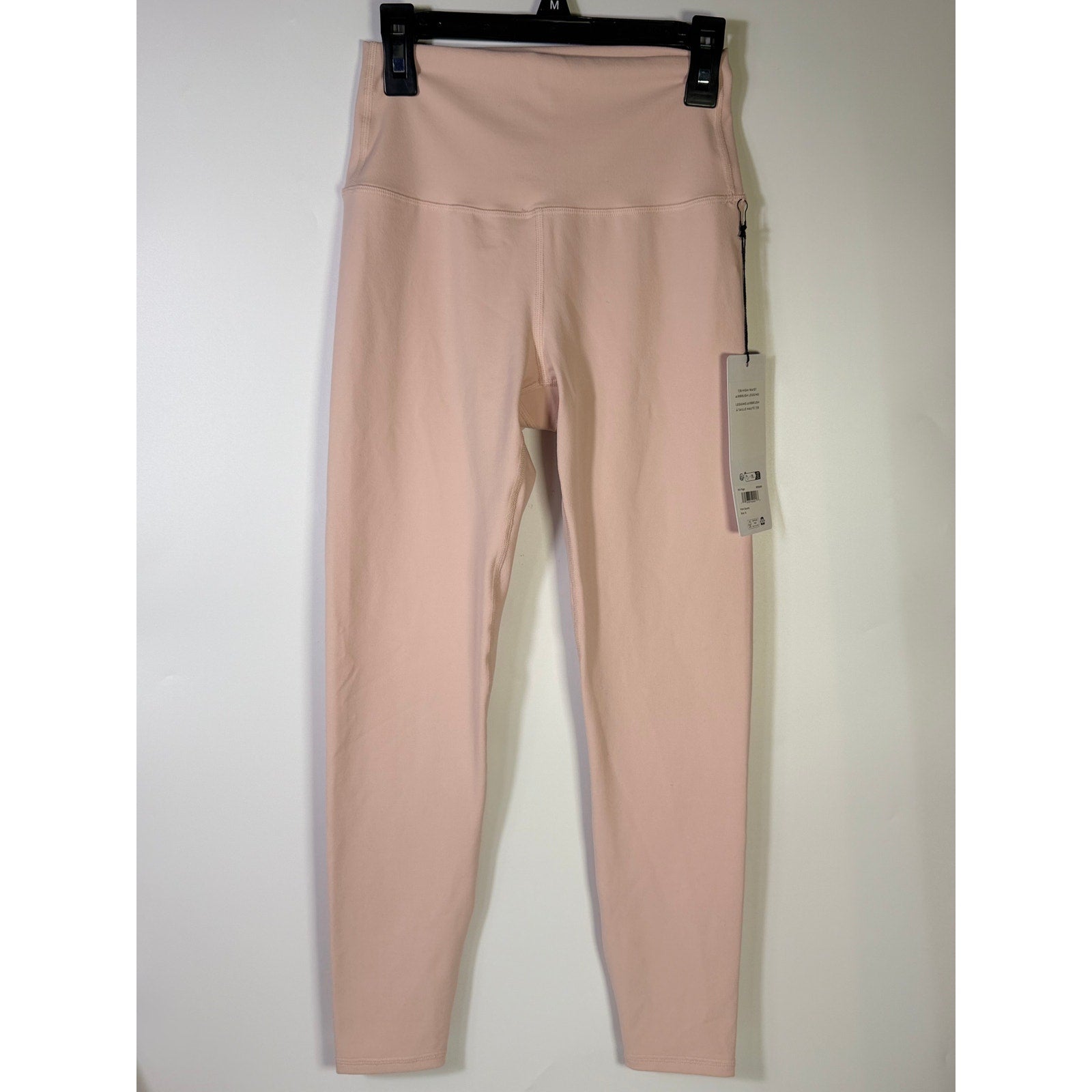 A pair of pink Alo Yoga 7/8 high waist Airbrush leggings for women, small size, displayed flat on a white background.