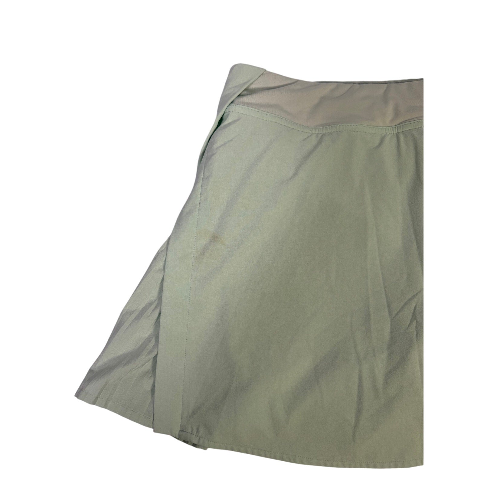 Lululemon women's light mint pleated tennis skort with built-in shorts, size 6, featuring a sporty and stylish design.