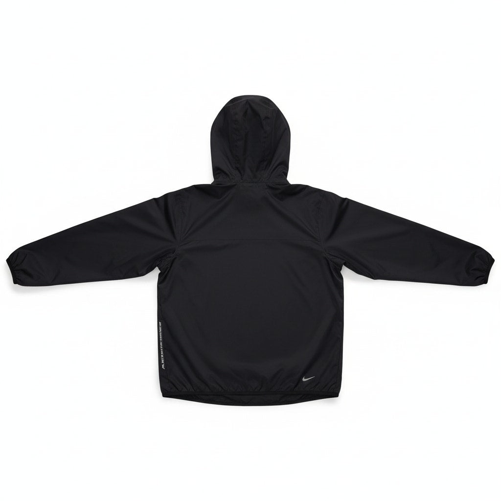 Men’s Nike ACG Trail Snacks Storm-FIT ADV jacket in black, showing the lightweight, weather-resistant jacket with Nike branding.