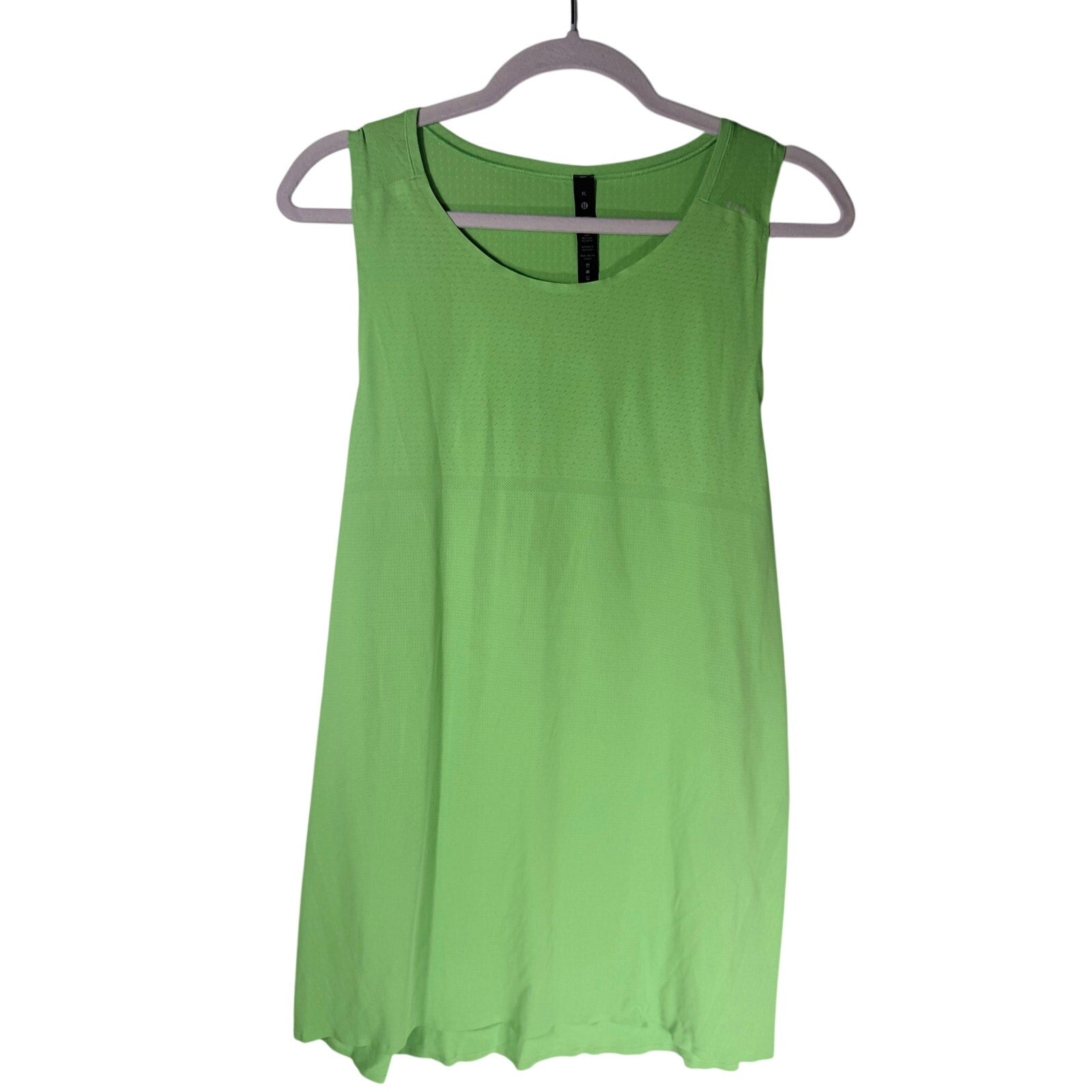 Lululemon women's lime green open-back athletic tank top in size XL, showcasing the stylish back design and breathable fabric.