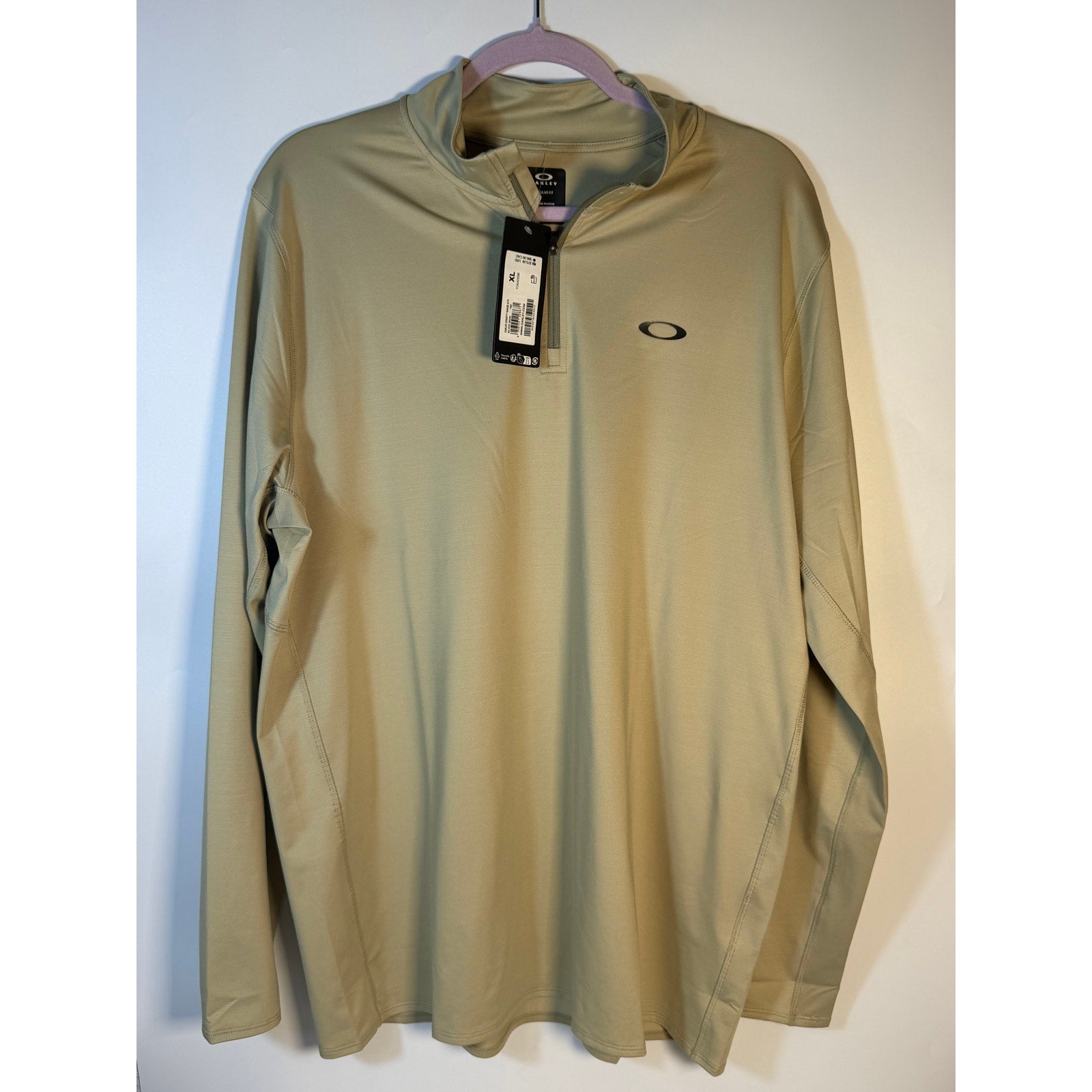 Under Armour Oakley Gravity Range quarter zip pullover in silver sage, XL regular fit, displayed on a mannequin.