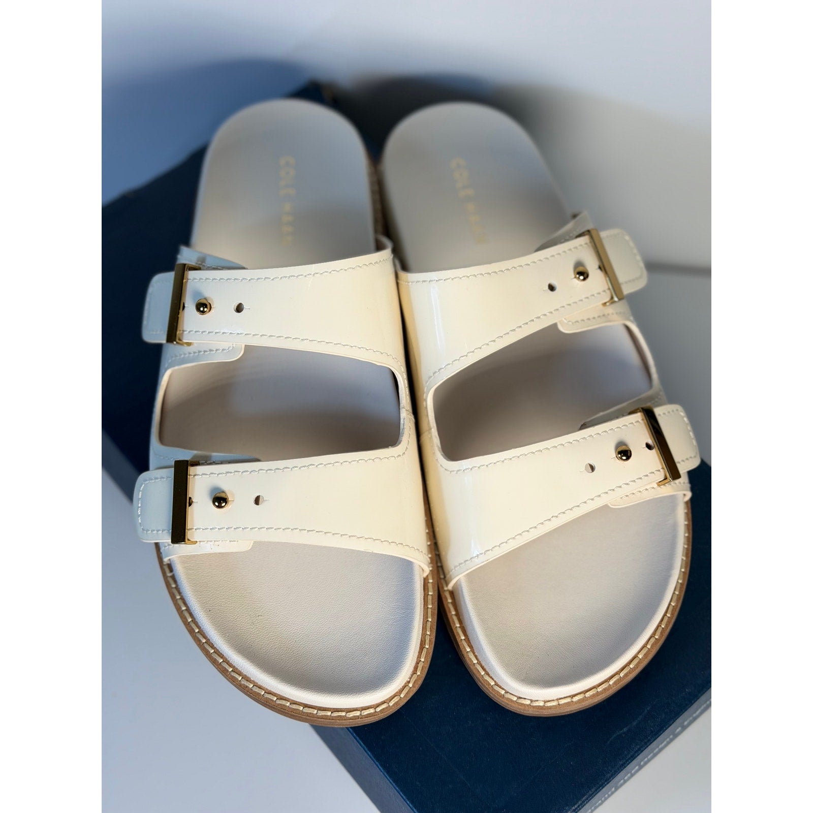 White leather Cole Haan women's buckle slide sandals with open toe and chunky heel, size US 9B, new in box.
