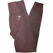 Gymshark Vital Rise leggings in maroon, small size, showing the fitted high-waist design and smooth fabric detail.