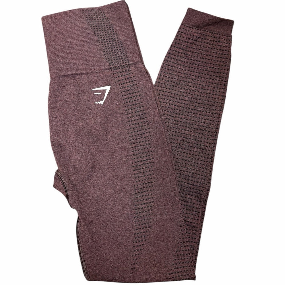 Gymshark Vital Rise leggings in maroon, small size, showing the fitted high-waist design and smooth fabric detail.