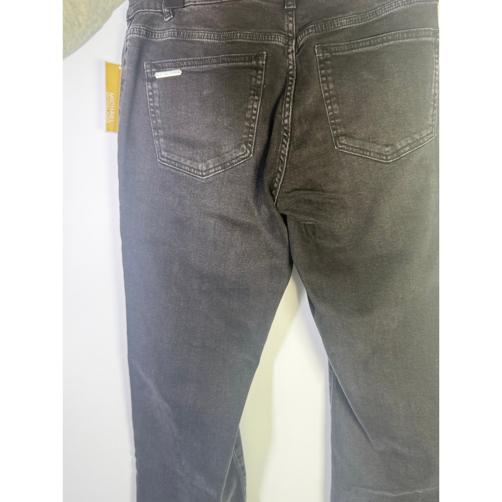 MICHAEL Michael Kors women's cropped flare jeans in washed black, size 4, with a high-waisted fit and stylish distressed details.