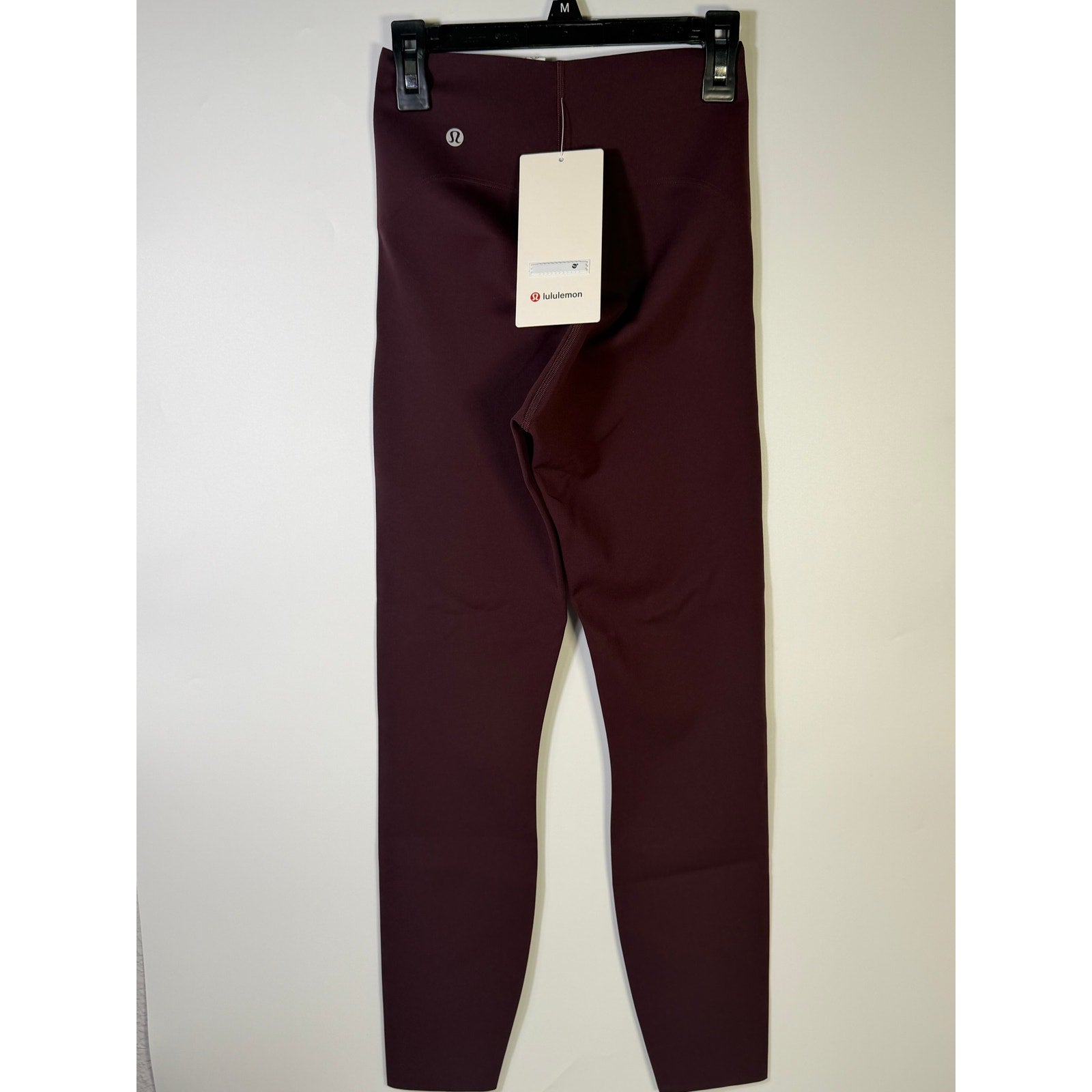 Lululemon Glow Up SHR Tight 25-inch women's leggings in size 4, close-up of black athletic leggings with reflective details