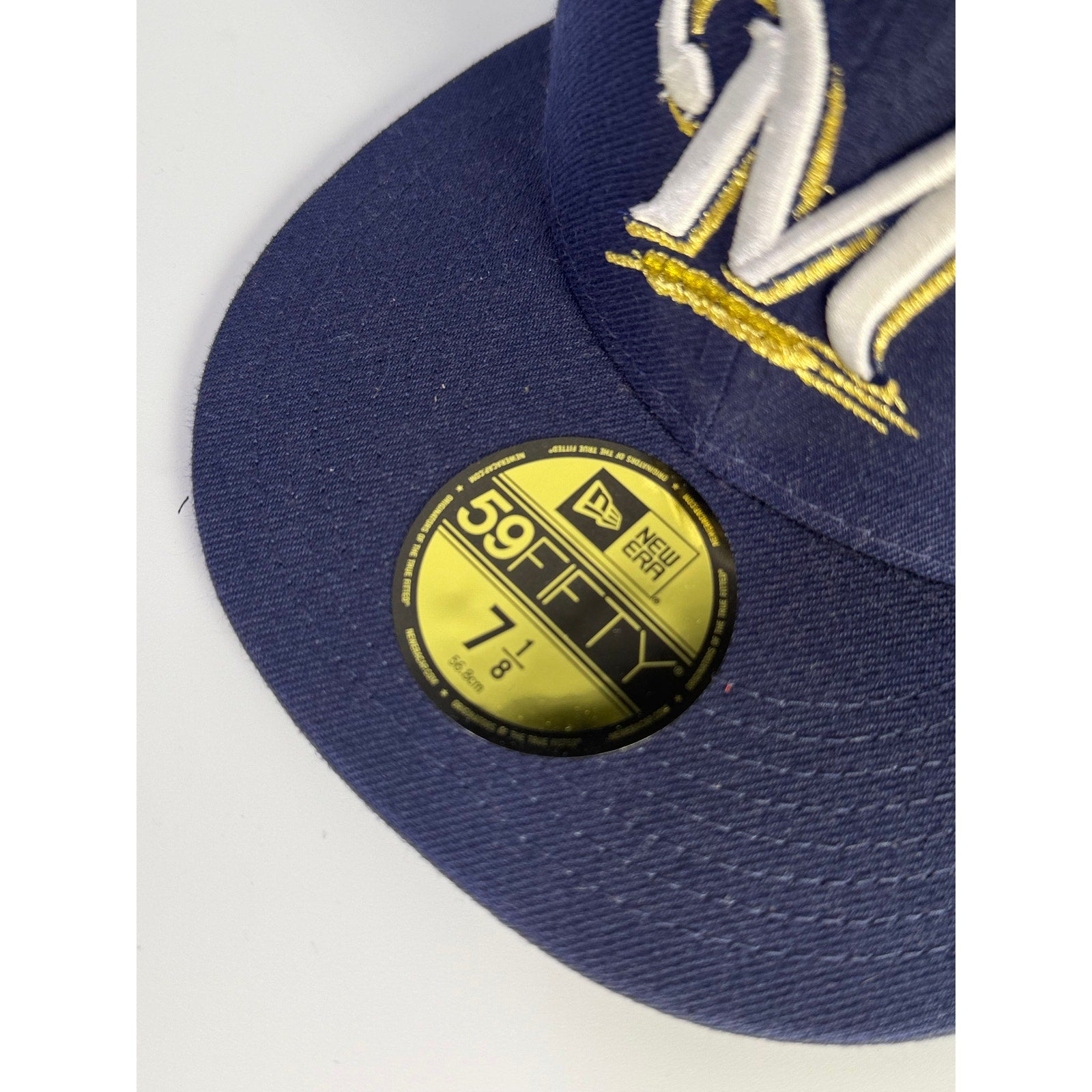 New Era Milwaukee Brewers 59FIFTY fitted cap in blue, size 7 1/8, MLB team hat, front view with team logo.