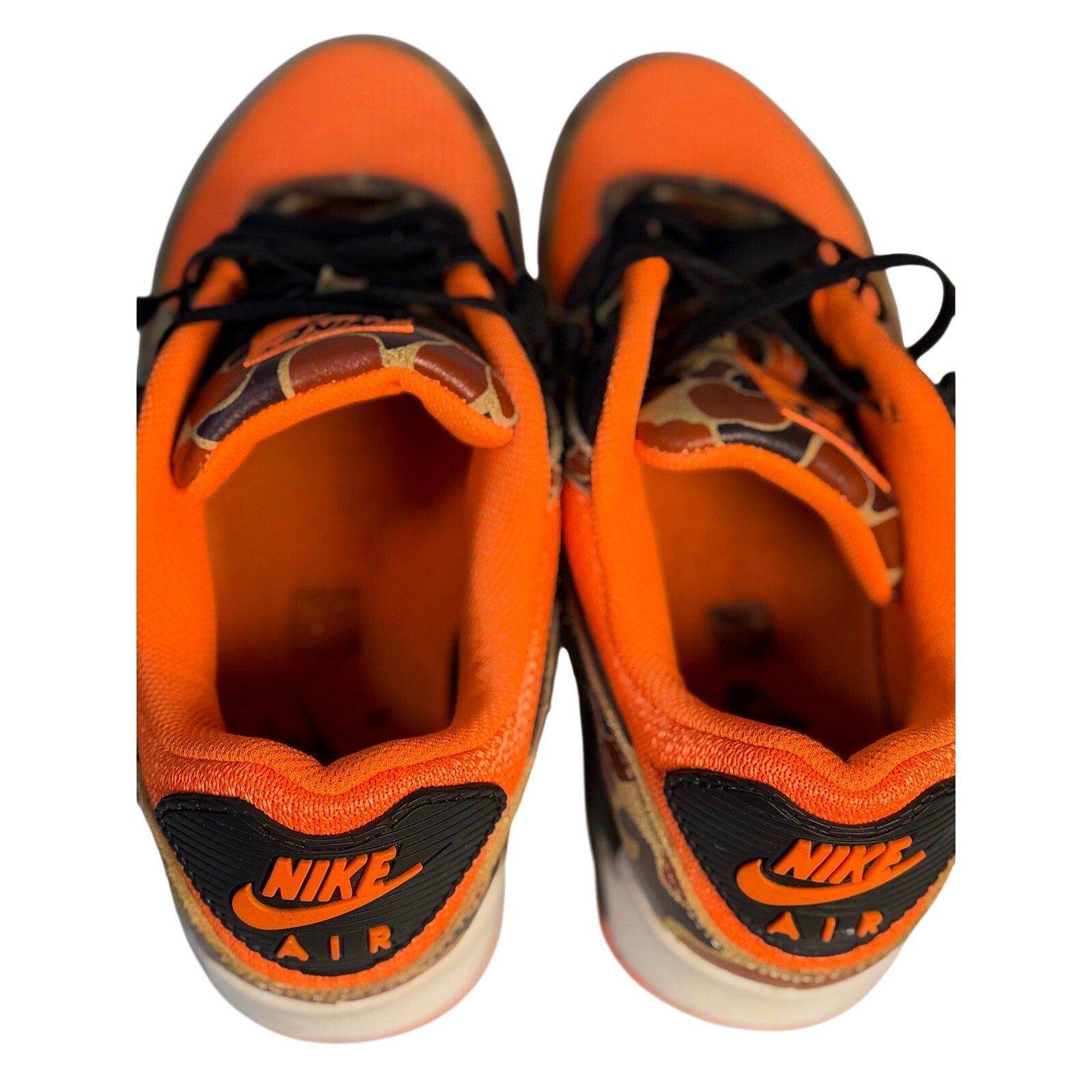 Nike Air Max 90 orange camo black sneakers for men, size 11, with stylish camouflage design and Nike branding.