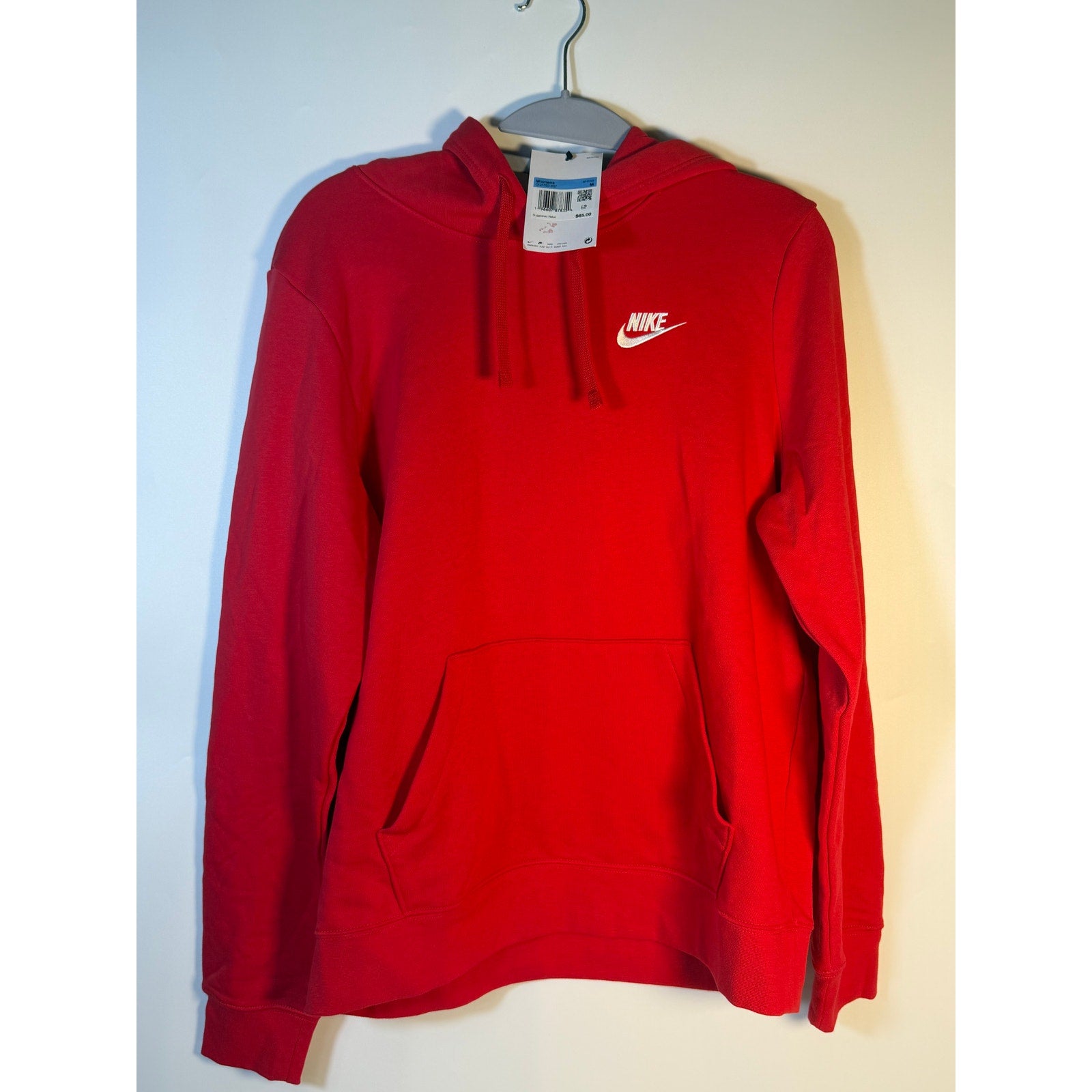 Women's red Nike Sportswear Club Fleece hoodie, medium size, soft fleece material, casual pullover sweatshirt with Nike logo.