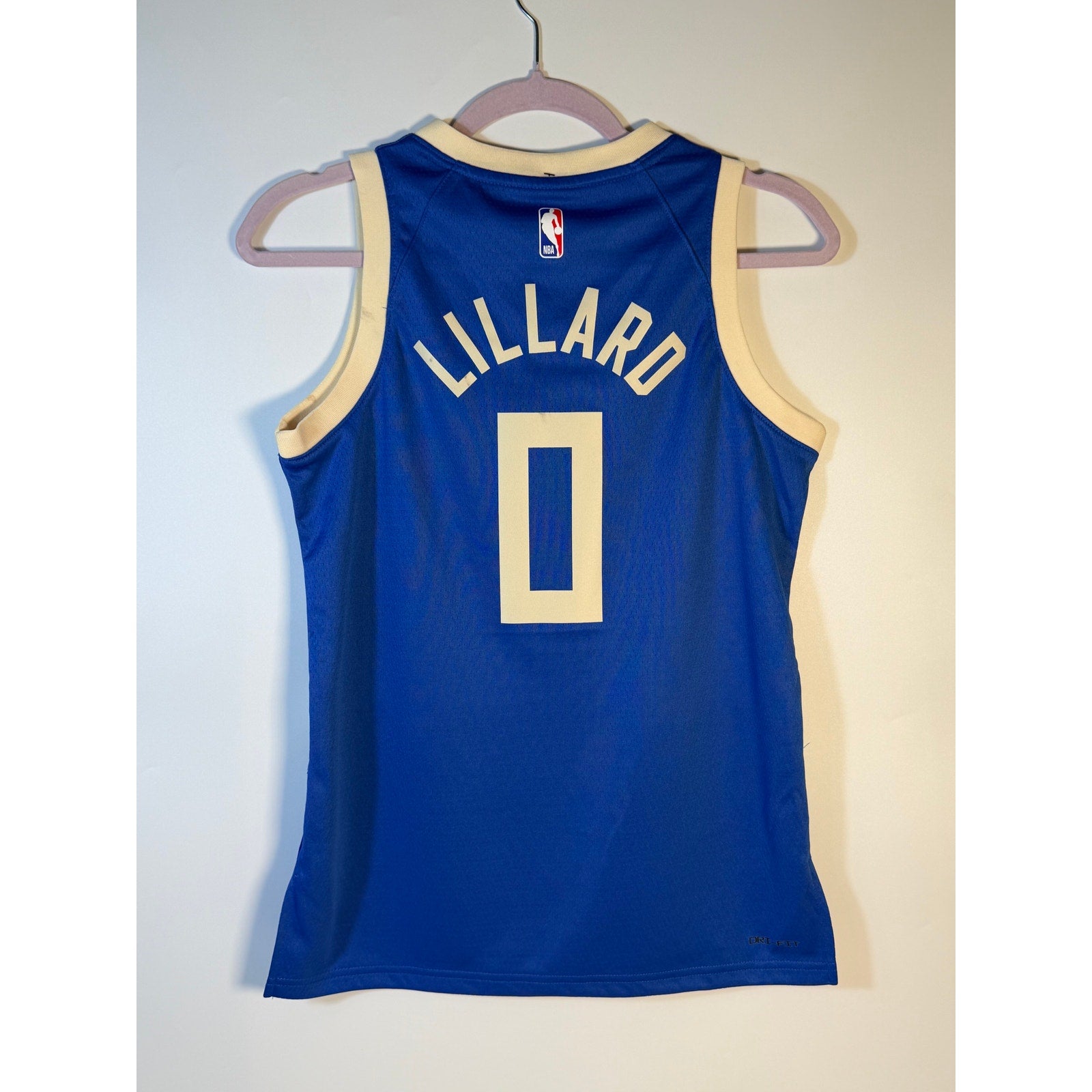 Nike Milwaukee Bucks Damian Lillard #0 City Edition youth jersey, size M, with Bucks branding and team logo.