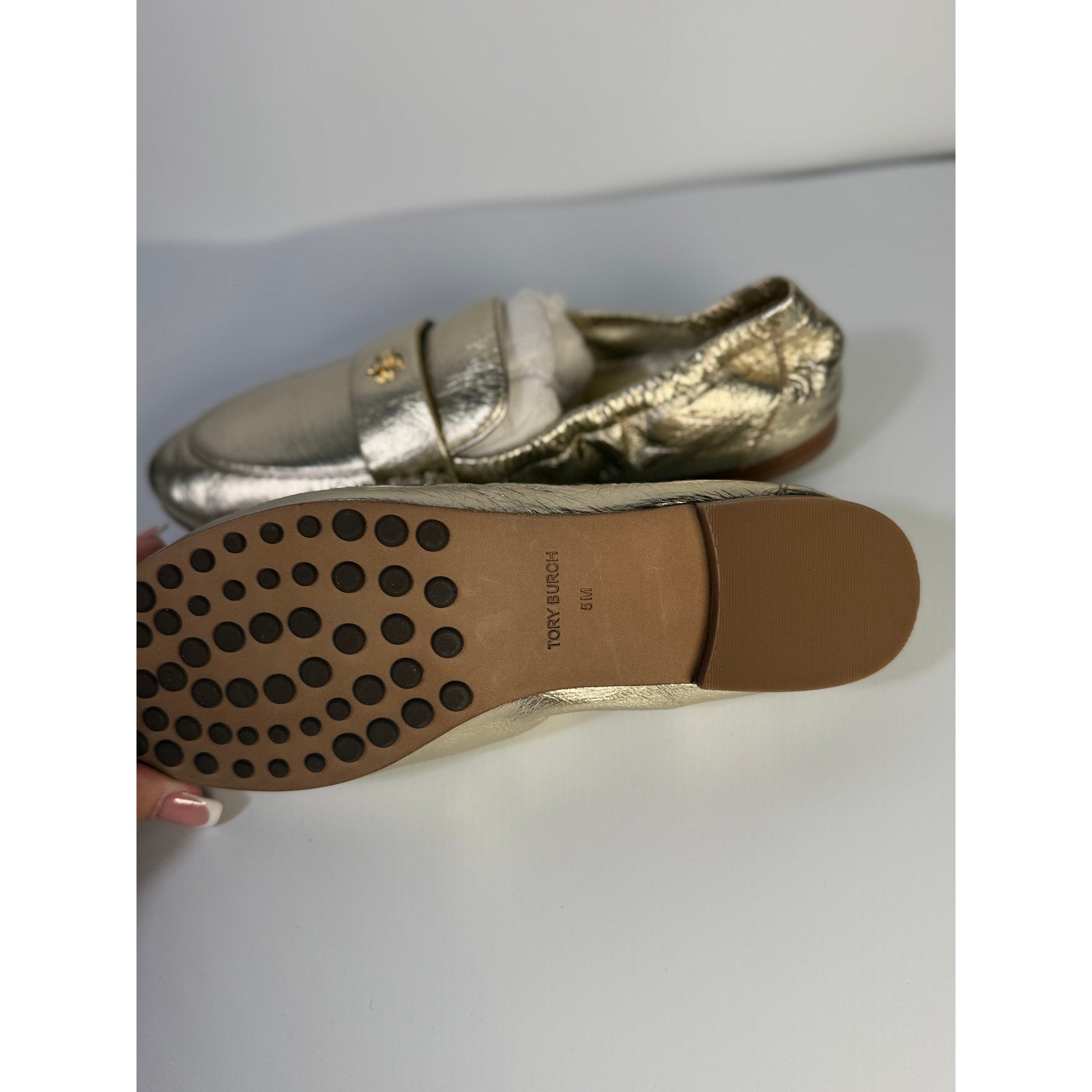 Tory Burch Women's gold metallic leather slip-on flats, size 5M, stylish and comfortable loafers for women.