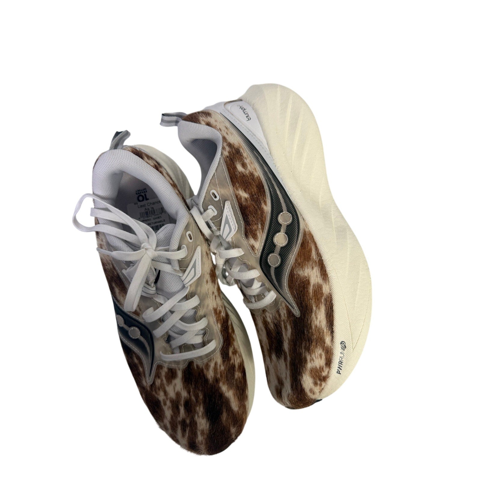 Saucony Women’s Endorphin Shift 3 Runshield athletic running shoes with cow print pattern, size 9, designed for performance.