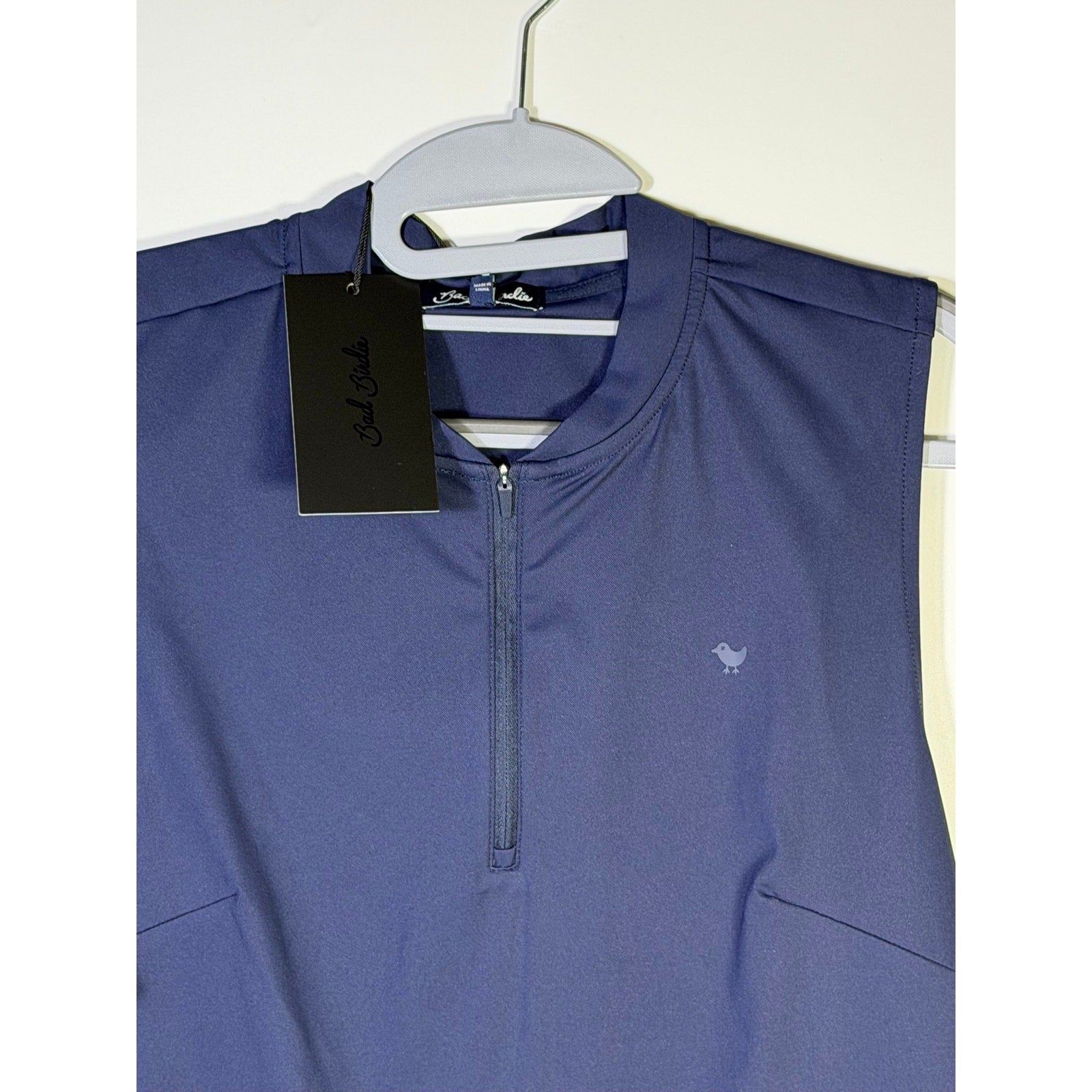 Bad Birdie women’s blue sleeveless golf polo tank top, quarter-zip style, shown in size XL with a sporty design.