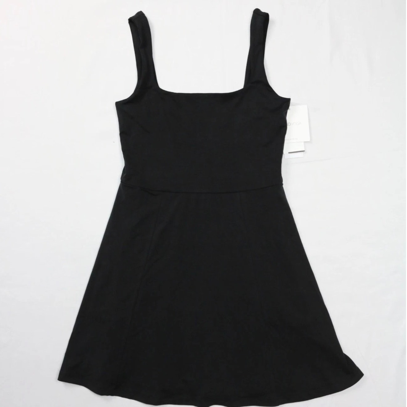 Beyond Yoga black women’s fit and flare mini dress, size medium, with a stylish, comfortable design, shown on a model.