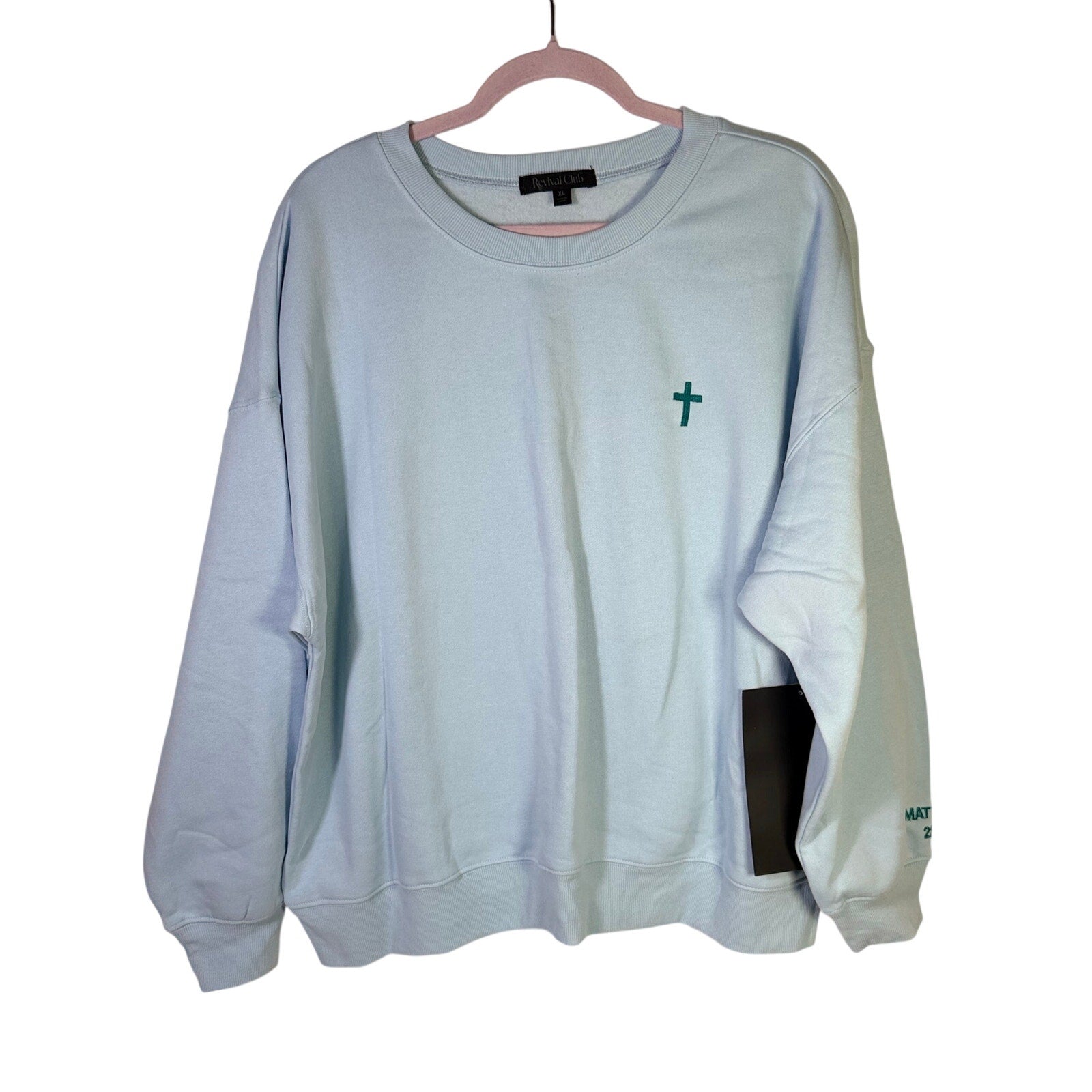 Light blue Revival Club Called and Chosen Christian sweatshirt in XL, showing the front design and soft fabric texture.