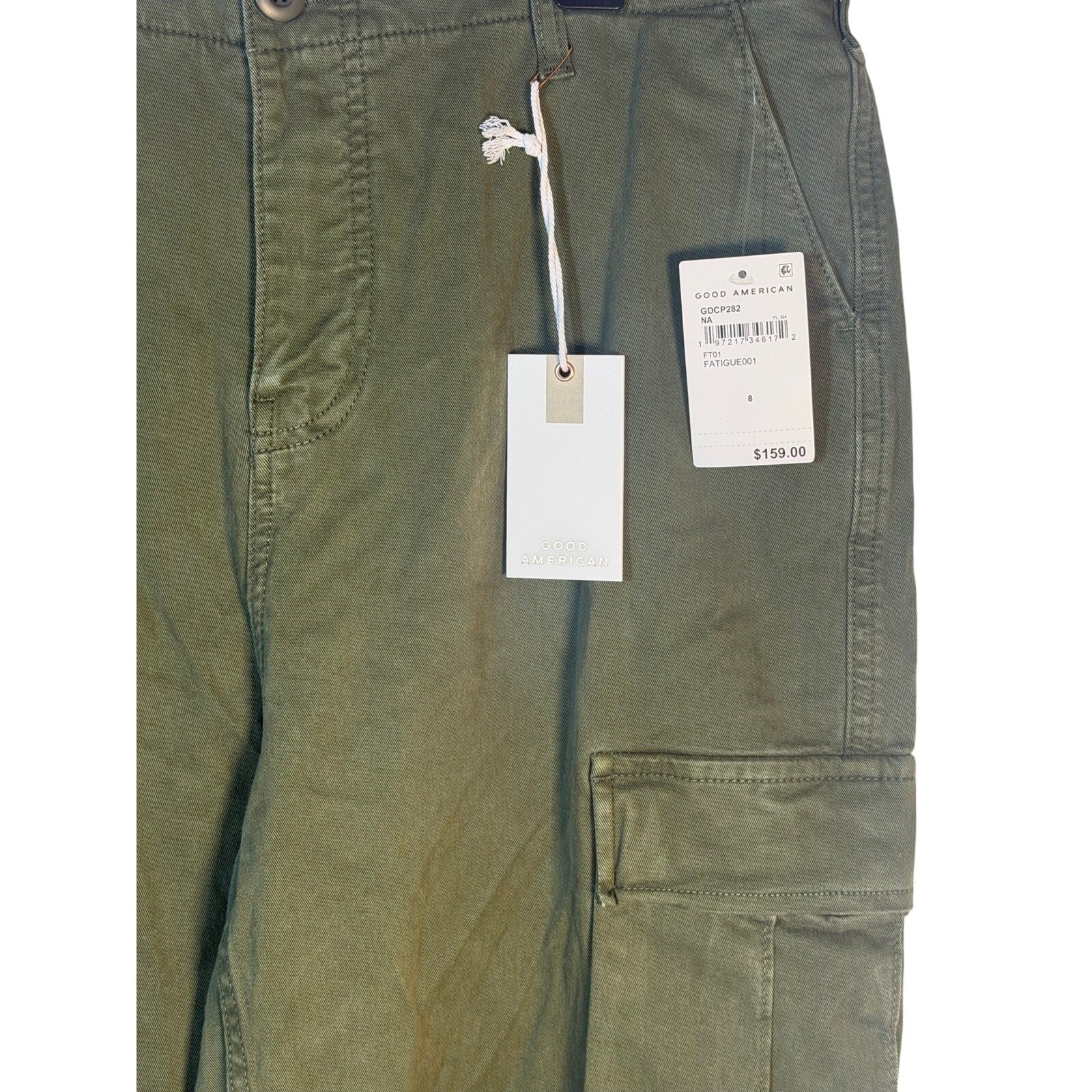 Good American olive green cargo pants in size 8, featuring a relaxed fit and multiple pockets, displayed flat.
