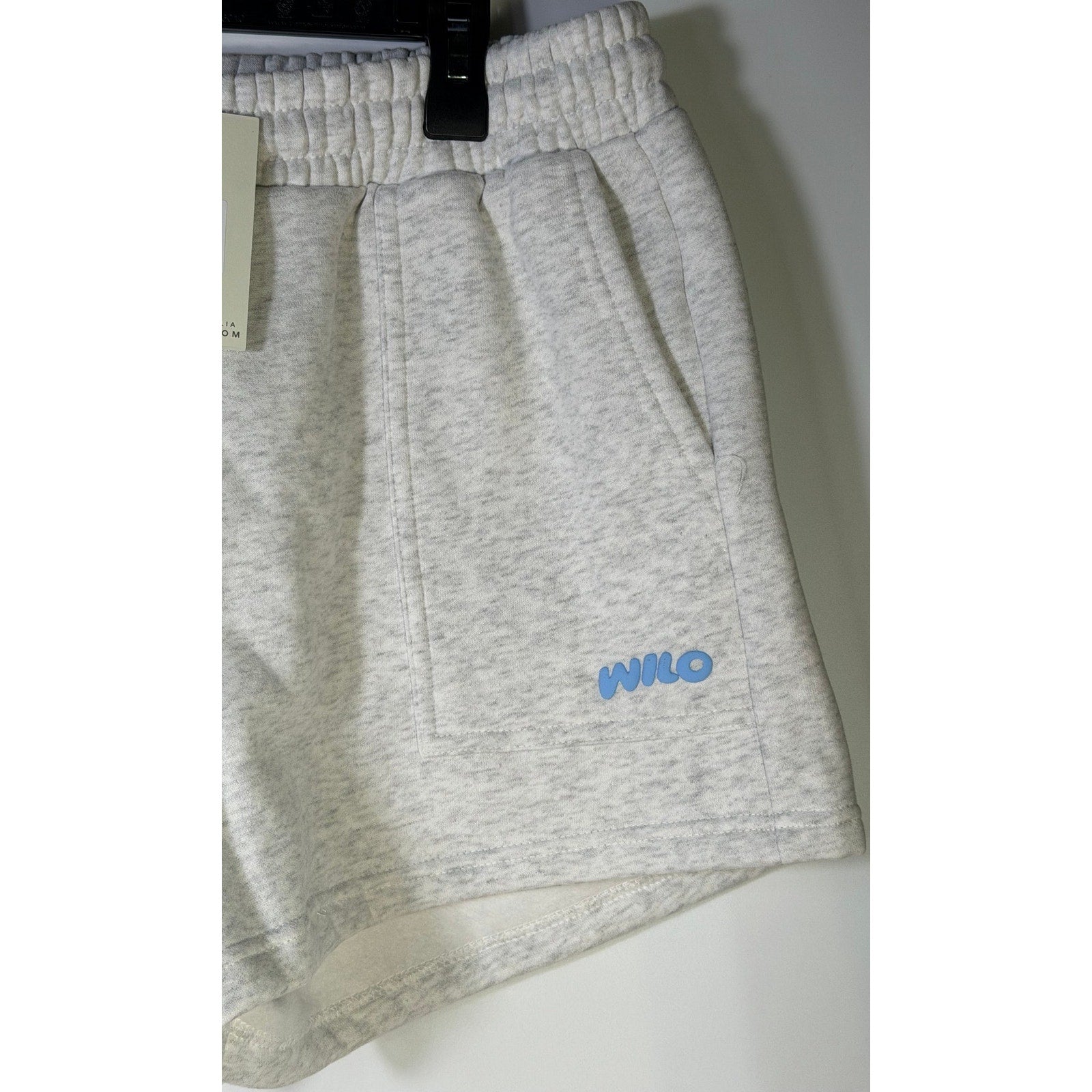 White marl fleece jog shorts for women by WILO The Label, size small, laid flat showing the relaxed fit and soft fabric.