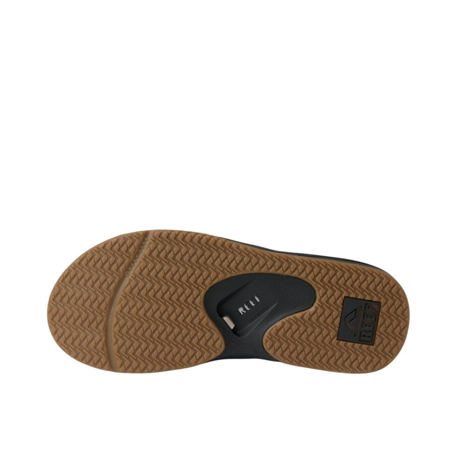 Reef Fanning men's flip-flop sandals in size 8 with black straps and cushioned footbed, casual footwear for warm weather.