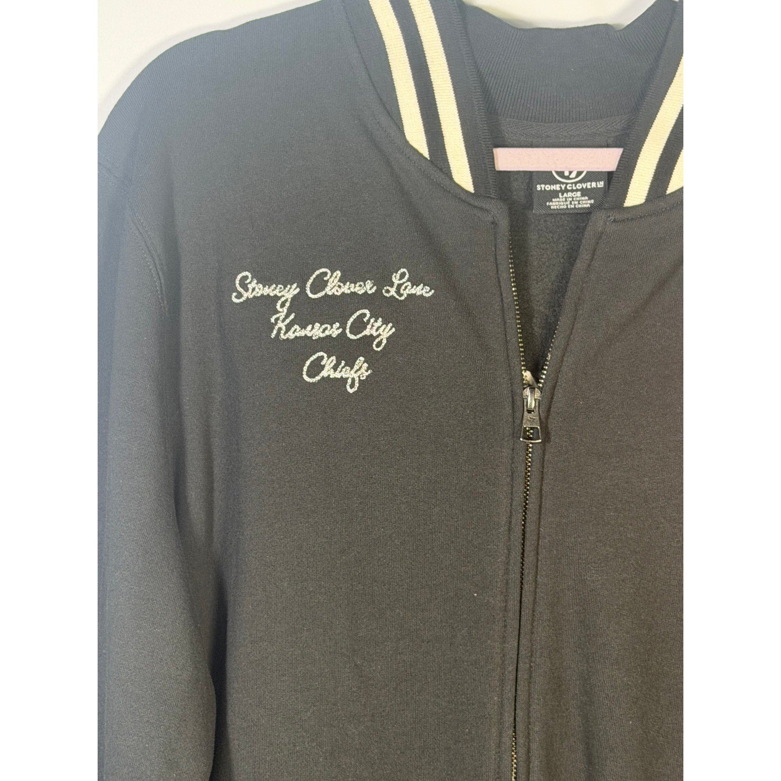 Stoney Clover Kansas City Chiefs women's varsity jacket in black, large size, new with tags, featuring team logo and varsity style.