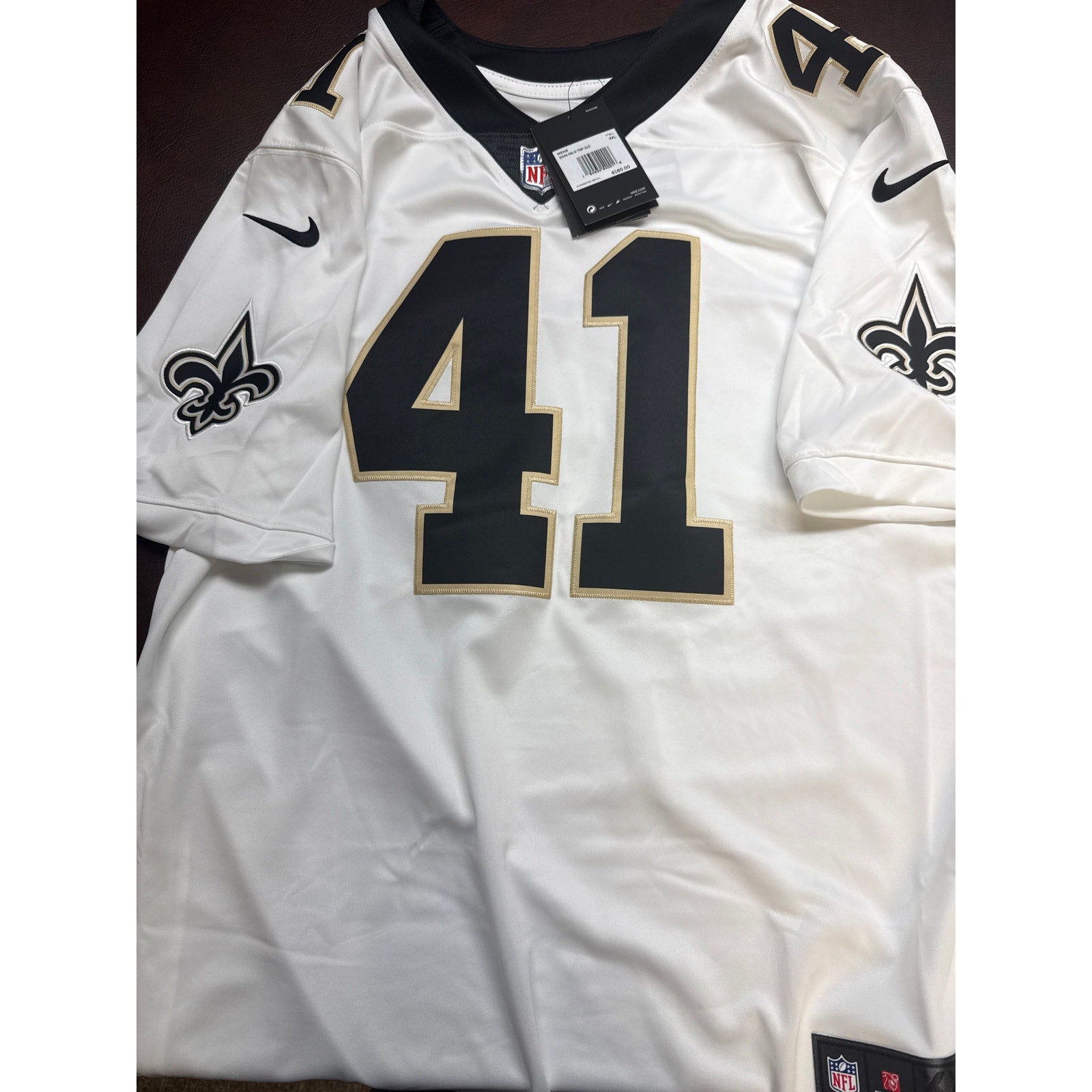 Nike New Orleans Saints #41 men’s NFL game jersey in white, size 2XL, with tags visible and team logo on front.