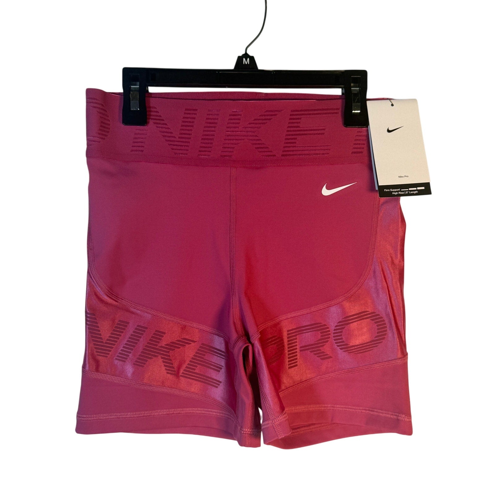 Nike Pro women's high-rise training shorts in berry color, small size, featuring firm support and athletic fit.