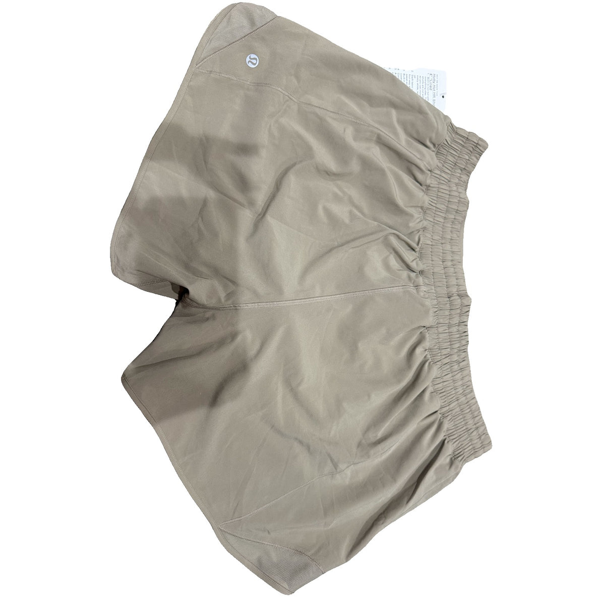 Lululemon Hotty Hot high-rise lined running shorts in tan beige for women, size 14, showing the front view with waistband and lining.