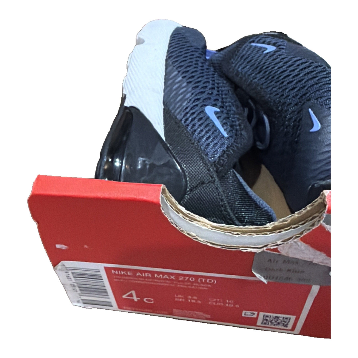 Nike Air Max 270 toddler sneakers in navy, blue, and white with visible branding and damaged box, size 4C.