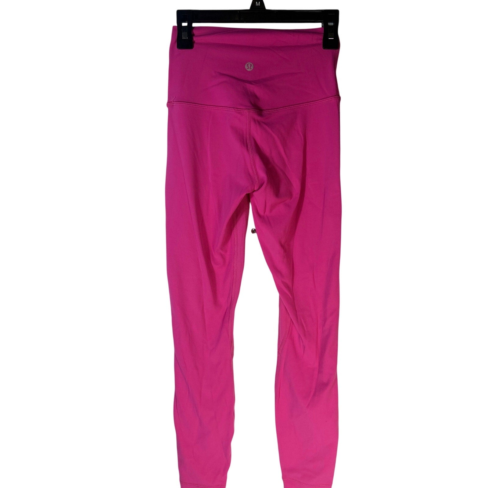 Pink Lululemon Wunder Under high rise leggings for women, showcasing the fitted athletic pants style and high waist design.