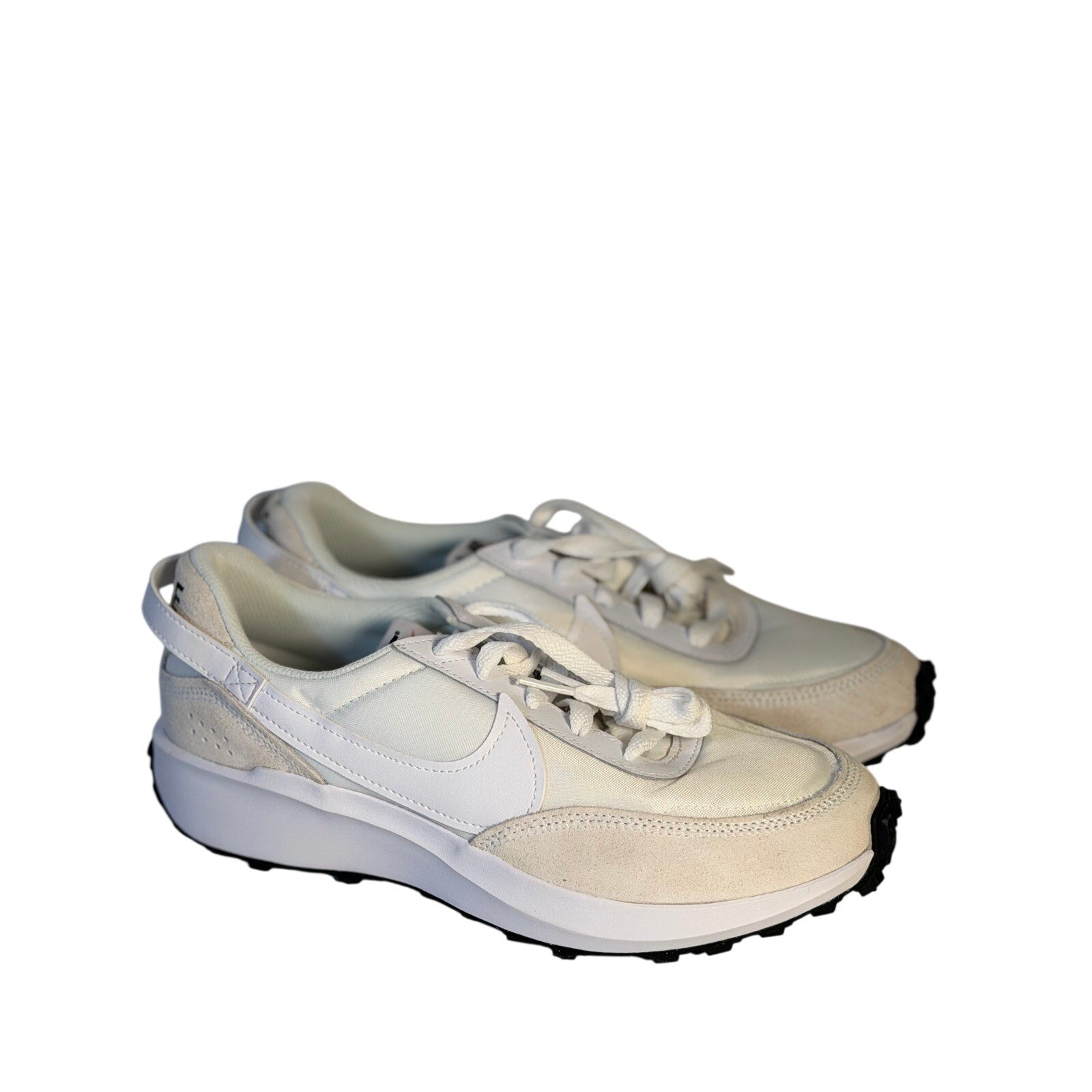 Nike Waffle Debut women's sneakers in size 9.5, showcasing the classic design with white and black colorways.