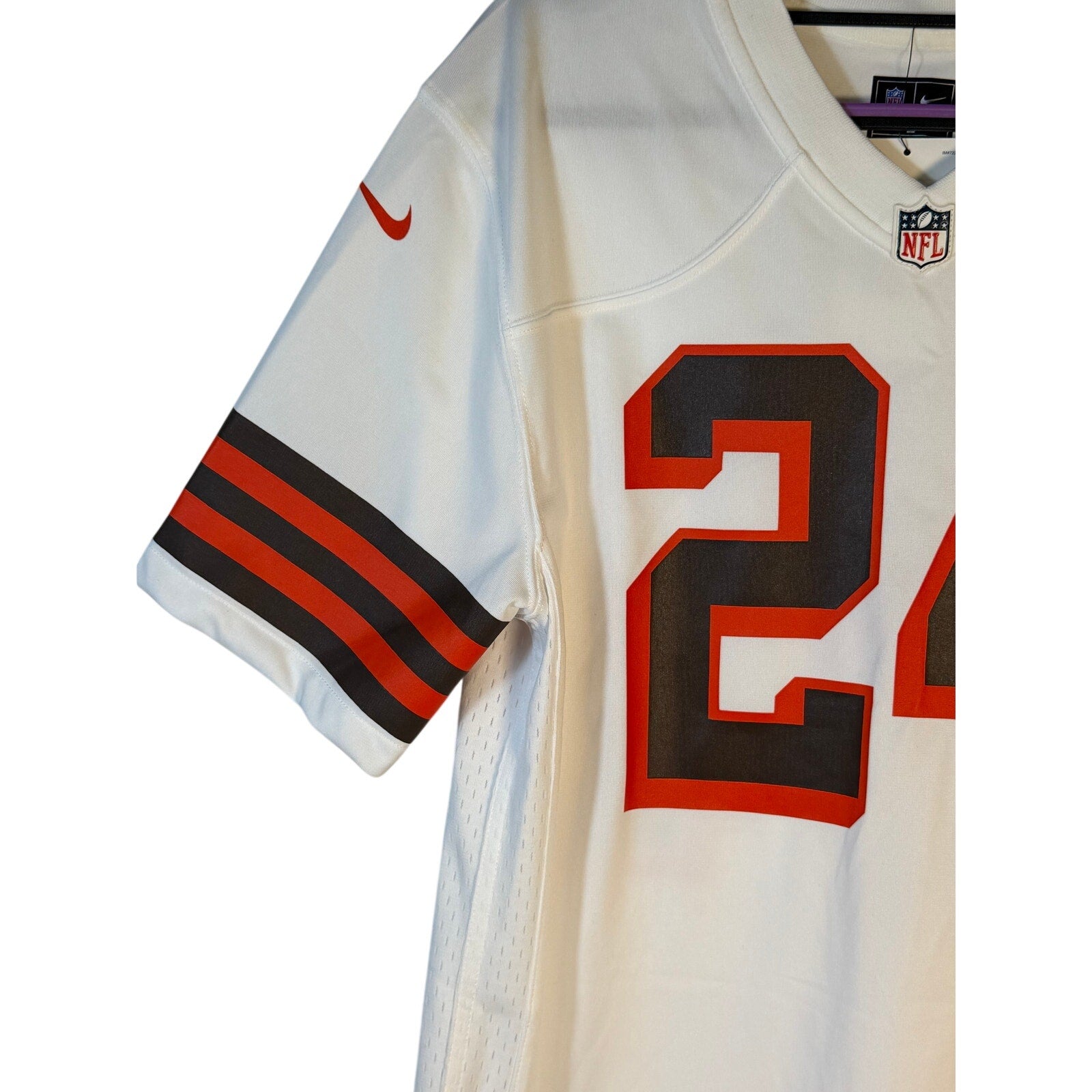 Nike Cleveland Browns #24 NFL white game jersey for youth large size 14-16, featuring team logo and player number.